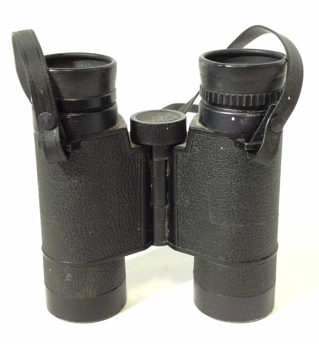 Vintage NIKON 9x30 Binoculars: THis is a vintage pair of binoculars for NIKON, the label reads NIKON 9x30 6.7 degrees. The strap is still attached to the binoculars, some wear is present on the piece. The wear is consistent with ag