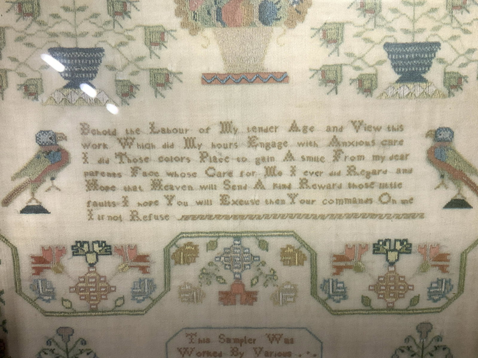 Framed Print of Embroidery Sample: Print of embrpidery sample, sample of possibly a family project, text in lower section reads ‘This Sample Was Worked By Various Hands And Finished In The Year Of Our Lord 1819’, text in upper cent