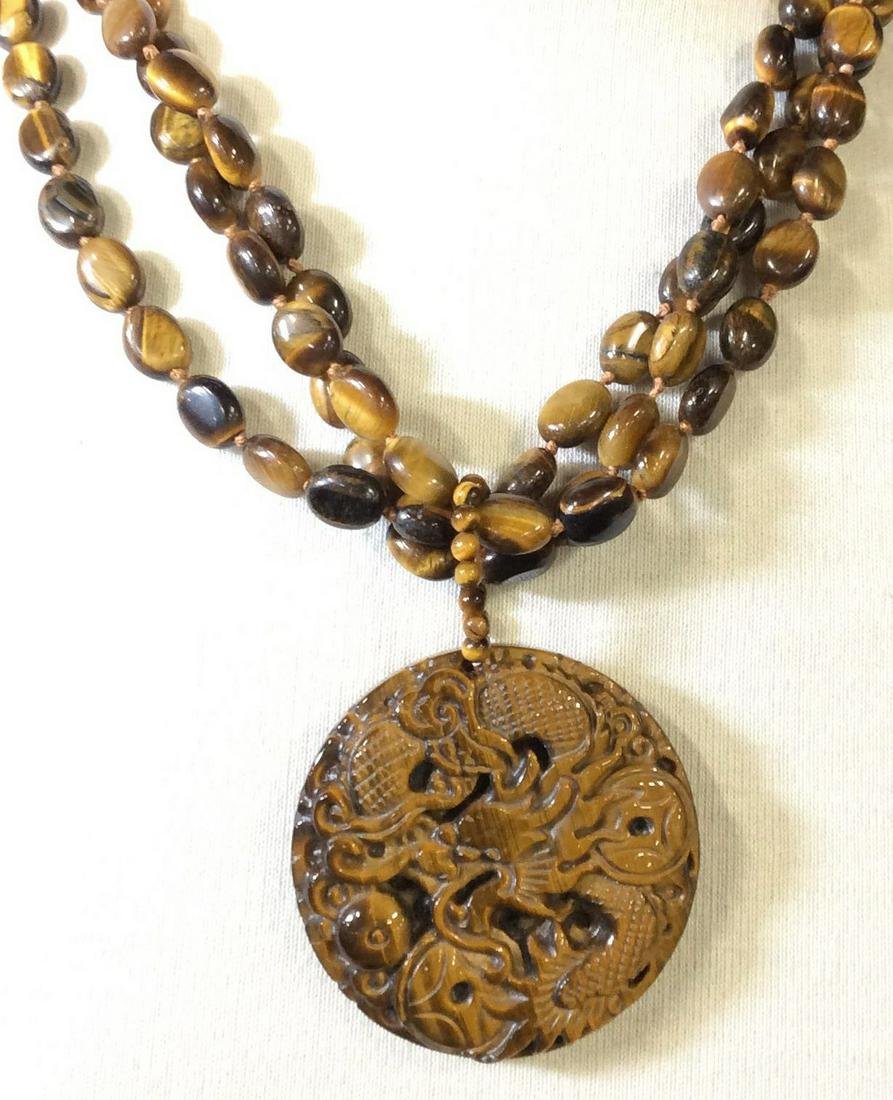 Authentic Tigers Eye Asian Dragon Necklace: Multi Strand Tiger Eye Beads (10 mm) with adjustable Sterling Silver Adjustable Chain ( reads 925 in lobster clasp).Micro Tiger Eye bead bail, 2 in. diameter CARVED TIGER EYE pendant with dragon wrapp