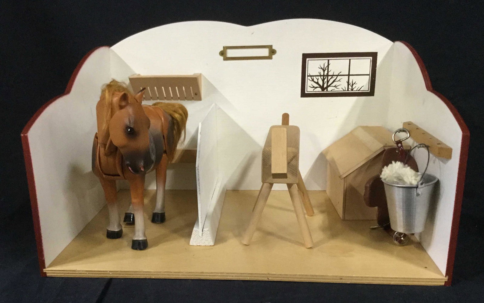 Vintage Horse and Stable Play Set: Vintage, possibly Antique equestrian play set. Set includes moving, poseable horse. Set also includes stable with fixtures on the walls, moveable furniture and accessories including a saddle, a pail, 