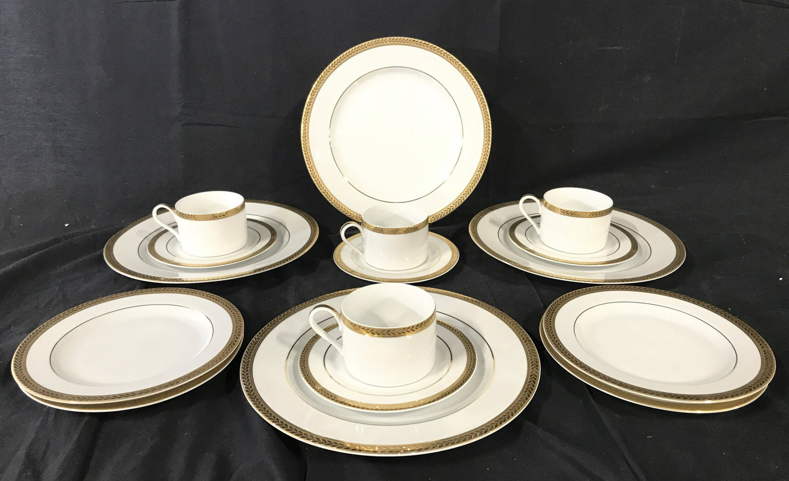 Set 16 BLOCK MANCHESTER GOLD Porcelain Tableware: Lot includes 4 dinner plates, 4 salad plates, 4 teacup saucers, & 4 teacups. Each is marked BLOCK MANCHESTER GOLD on underside. Dinner plates measure approximately 10.5 inches wide. Each piece has gol