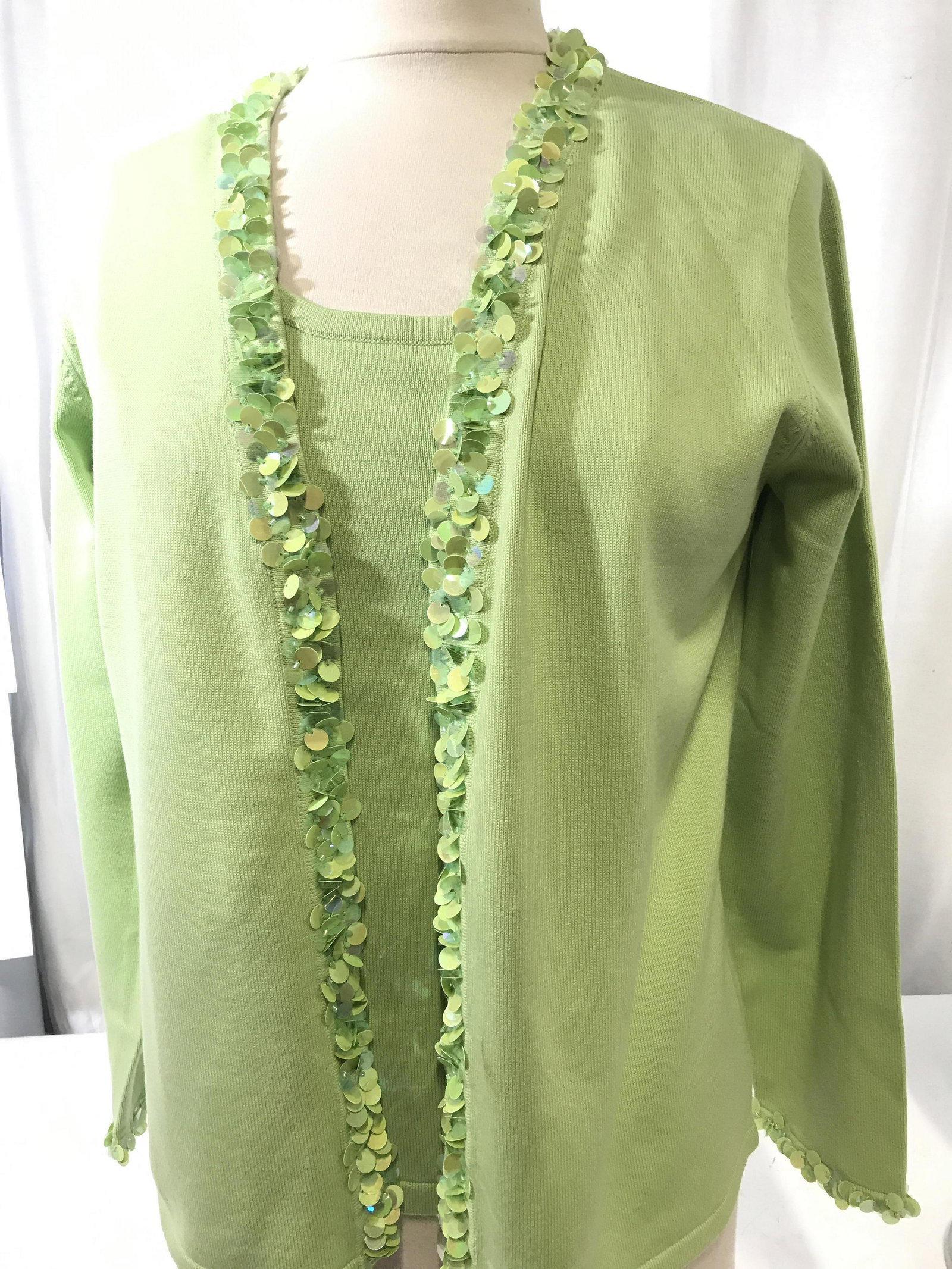 Louis Dell’Olio Spring Green Sequin Sweater Set: Línea by Louis Dell’Olio . Lime green sweater set. 48% acrylic, 40% Cotton, 2% spandex. Size M. Sleeves sweater top & Long sleeve cardigan with large round sequins along hems of collar, shawl colla