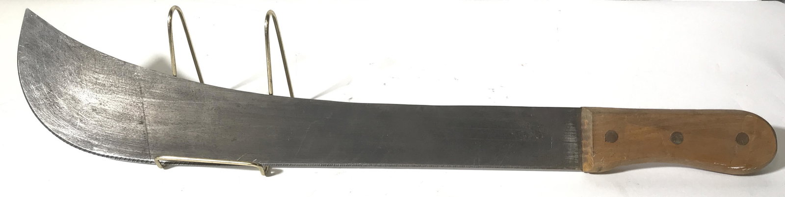 Vintage Decorative Machete: This is a vintage decorative machete. The piece shows signs of wear consistent with age and use. The piece measures approx 24 inches long. The handle has loosened to a degree. Machete, decorative blad