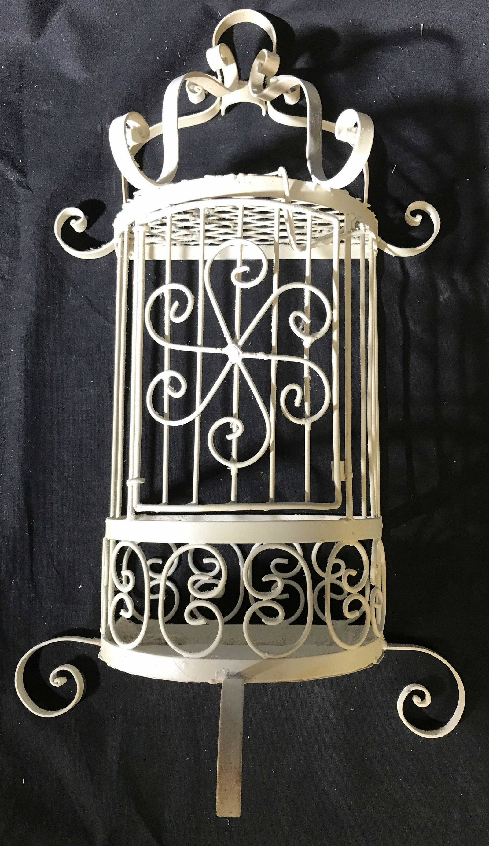 White Metal Scrolled Wall Shelf: Demi luxe shape with swing out door, Cage style, wall mount candle shelf, what not shelf, display grid wire and scroll work measures app ht 23 inches width 13 inches depth app 6 inches, one ring hinge