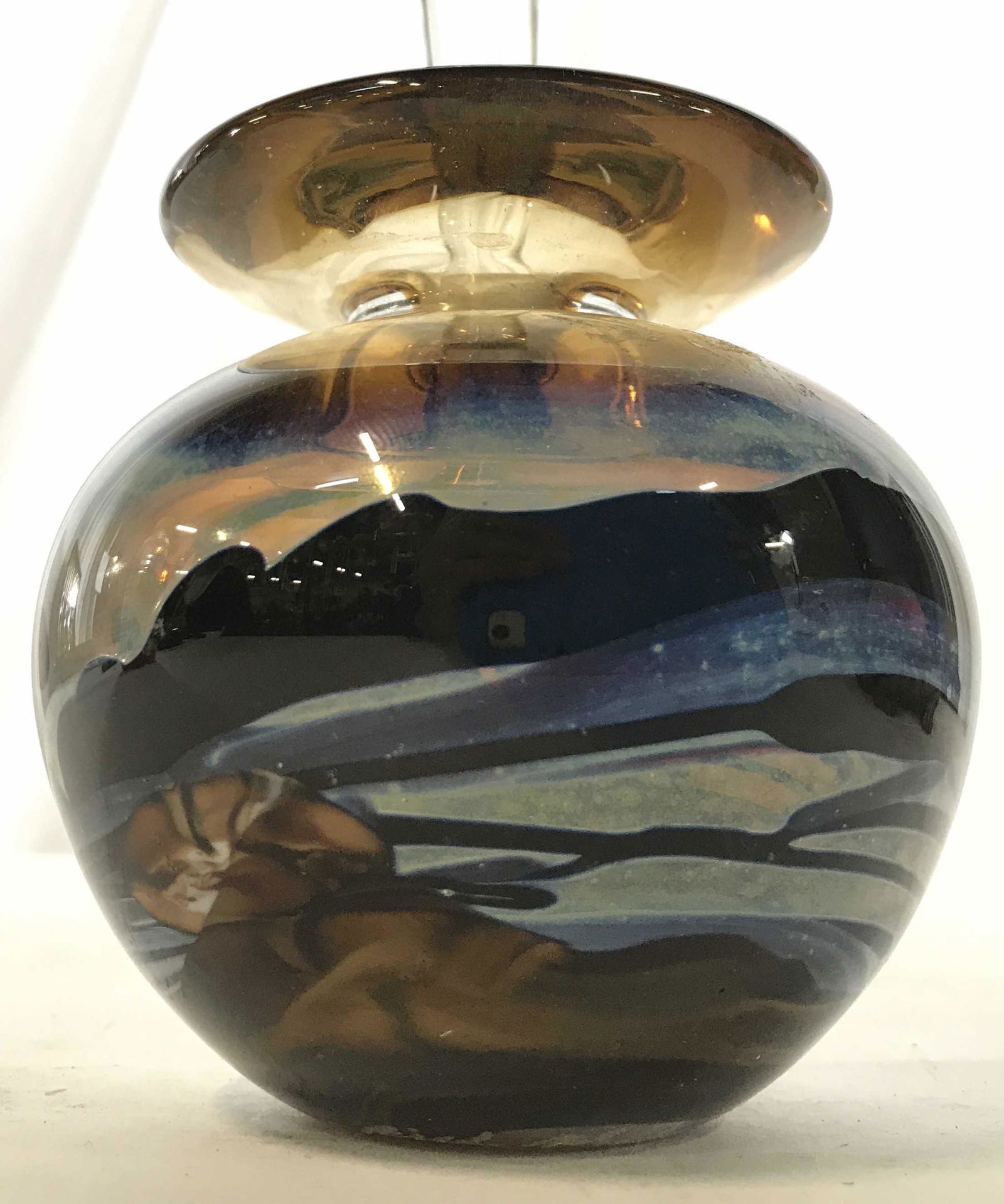 Signed RIEL MILLER Art Glass Perfume Bottle: Perfume bottle is SIGNED RIEL MILLER On Underside. Piece is possibly hand blown. Perfume bottle has stopper. Piece has various tones of blue brown and white. Piece measures approximately 5.5 inches ta