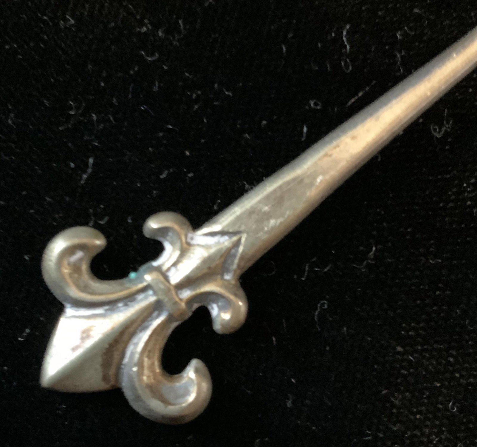 Sterling Silver Collectible Spoon: Marked for Sterling Silver, trademark and additional illegible markings, length app 4.5 inches, fleur de lis style handle. tableware flatware. property of Manhattan Estate.