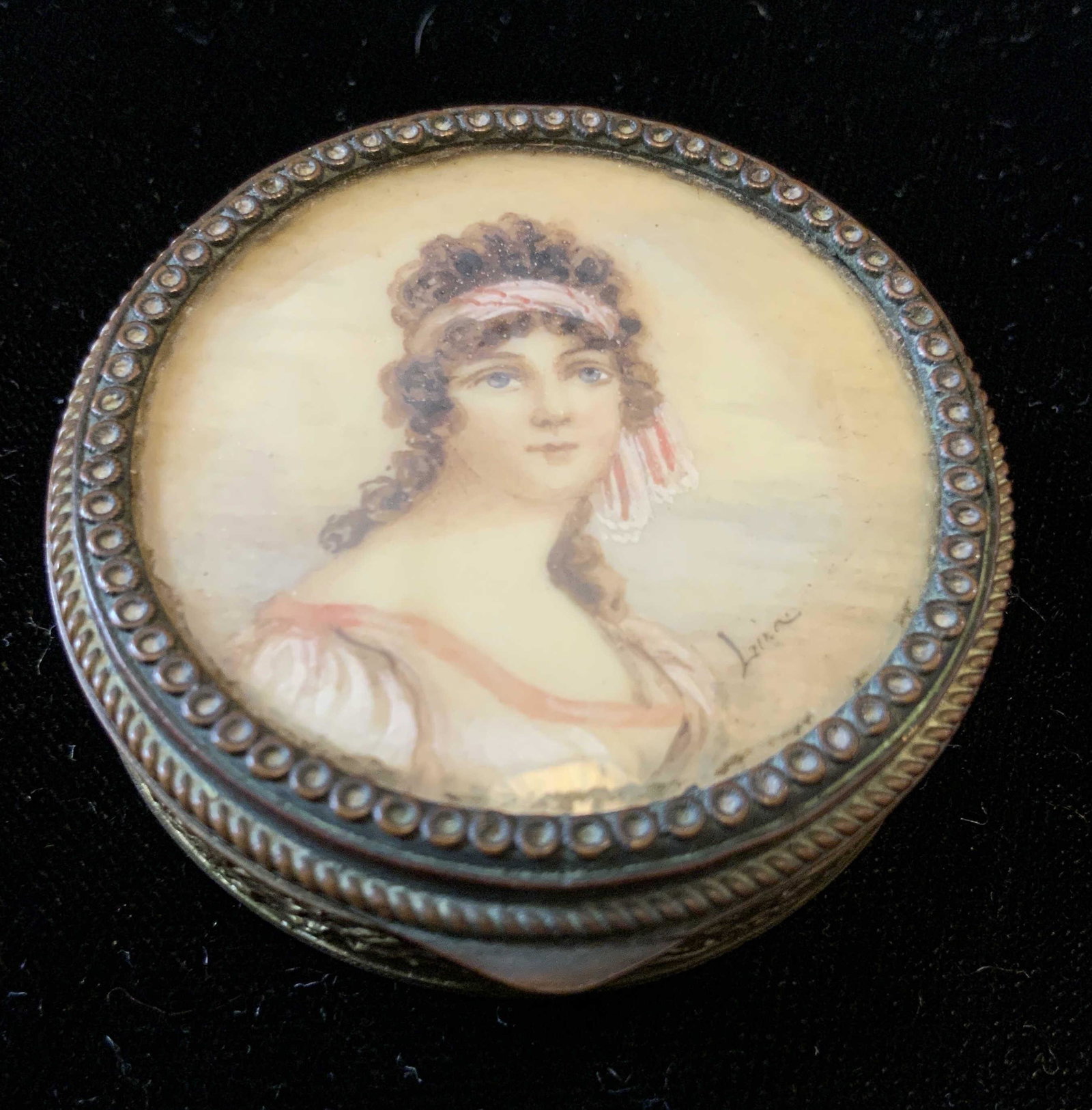 Antique Victorian Signed Portrait Pill Box, France: Underside marked made in France, Victorian hand painted portrait on lid signed Lina, Circular pill box with Victorian portrait encased in filligreed brass metal gilded pill box, mirror on inside lid, 