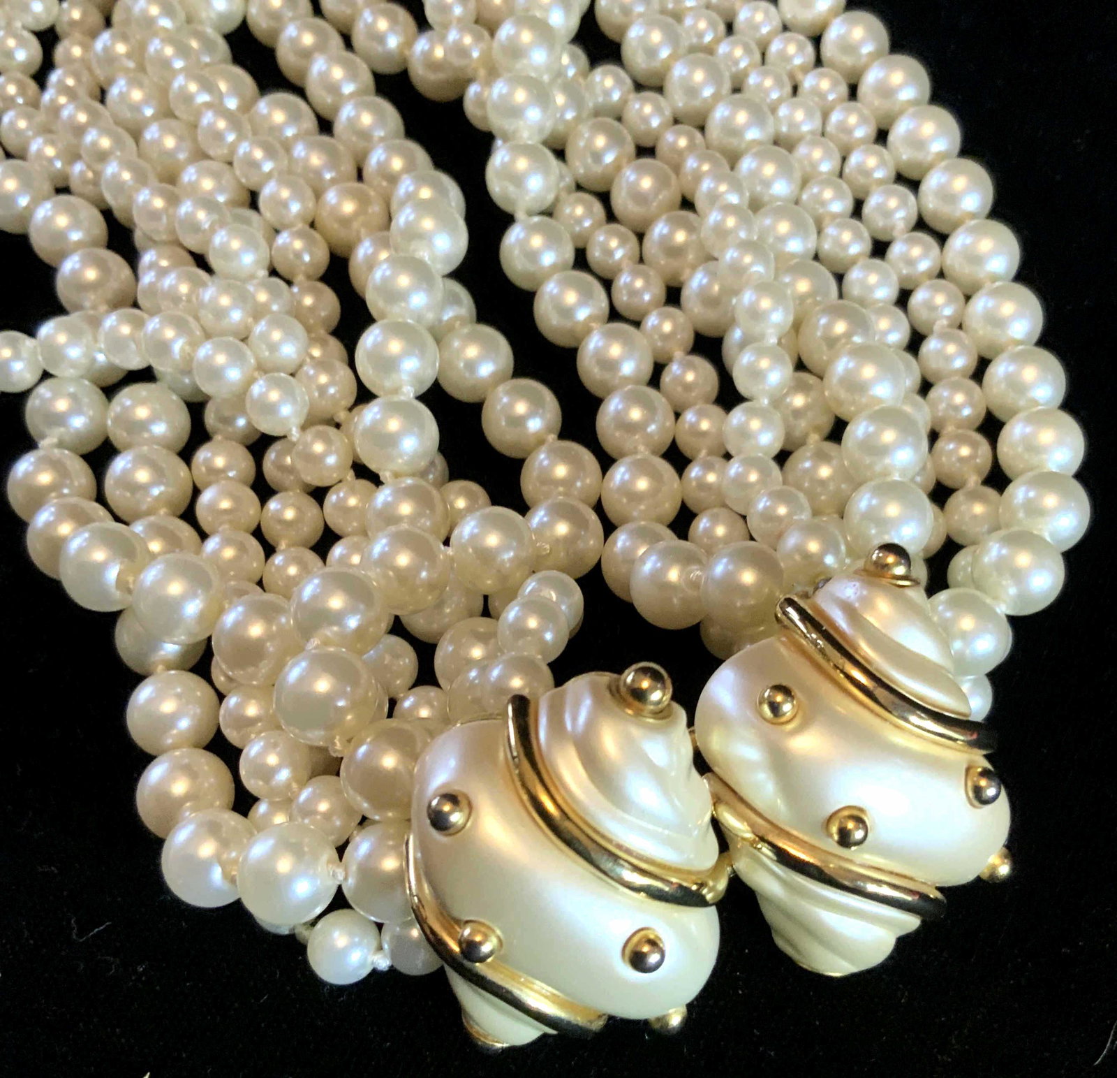 Kenneth Lane Necklace w Earrings: Jewelry set marked Kenneth Lane, luxury jewelry designer, conch shell form clasp to pearl style multi strand necklace matching conch shell style earrings, white enamel gold tone banding gold style bea