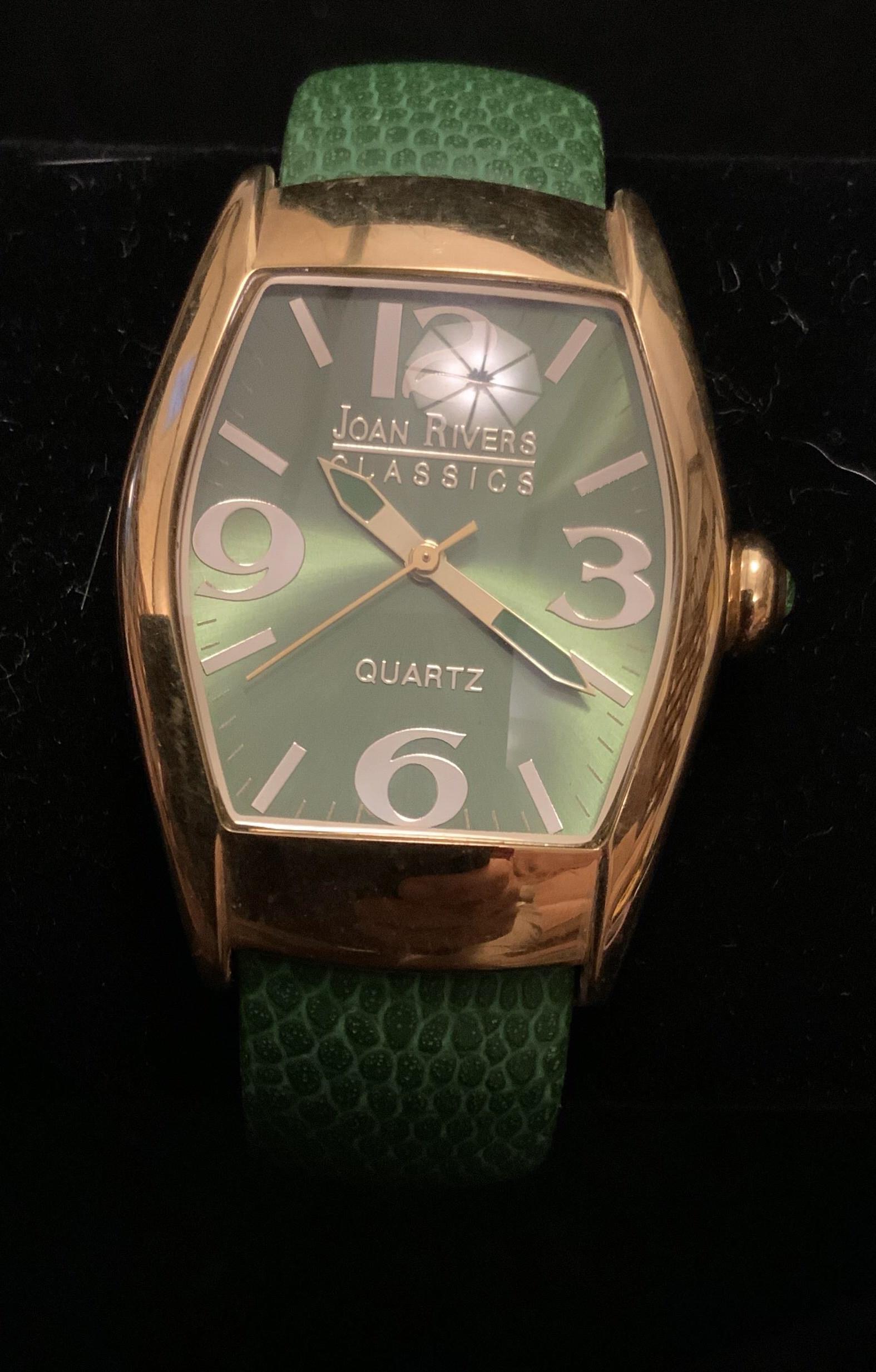 Joan Rivers Watch Cuff Bracelet: Green leather on gold toned frame, hinged open and close, oversized face, vintage jewelry, estate jewelry, watch face measures 2 by 1.5 inches