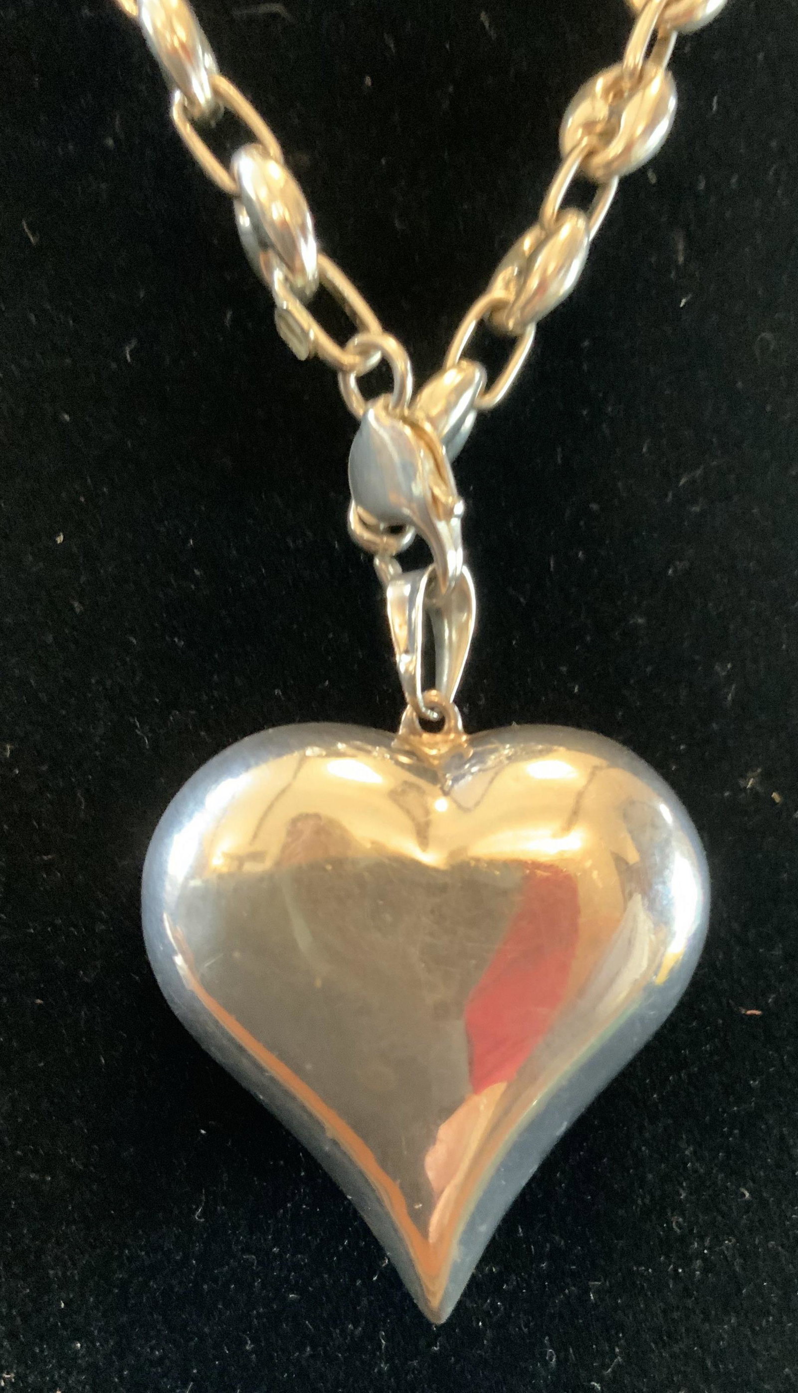 Sterling Silver Pillow Heart Necklace: Marked on heart 925, sterling silver pillow heart measures app 2 inches by 2 inches by .75 inches, on silver chain measures 22 inches full length estate jewelry, vintage jewelry, chain not marked for 