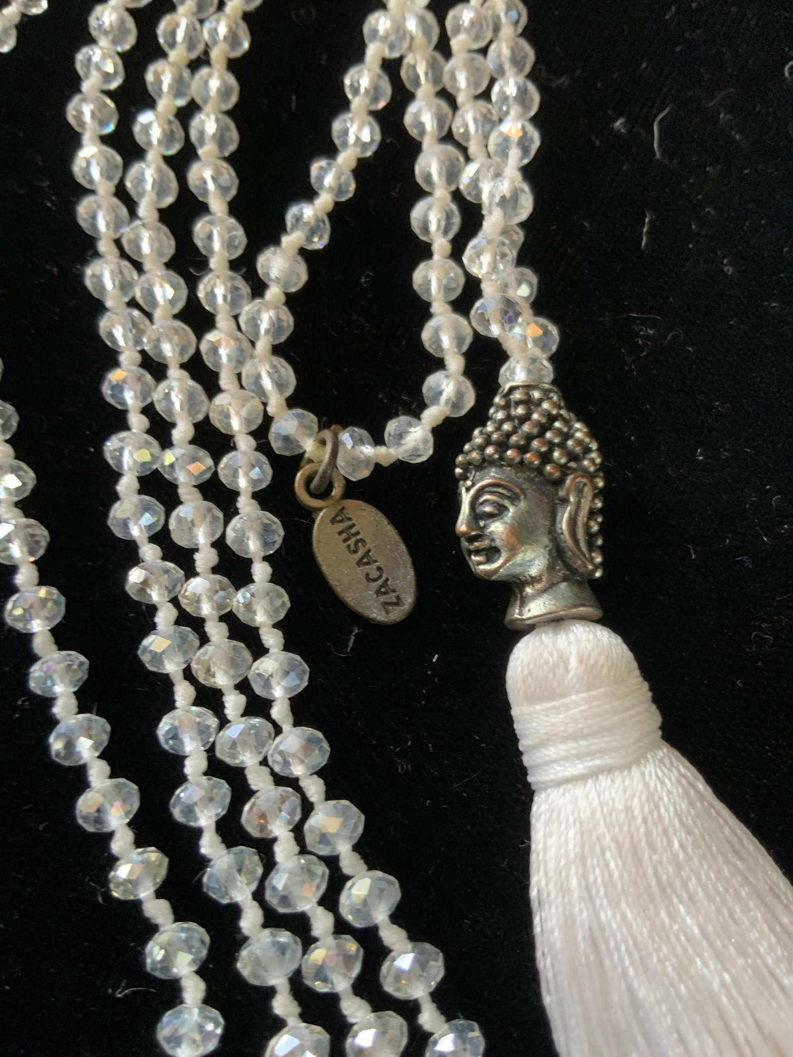 ZACASHA Bead Tassel Buddha Head Necklace: Micro bead or crystal necklace to silver toned Buddha head and white Tassel, fashion jewelry, estate jewelry, drop measures 23 inches, tag for Zacasha