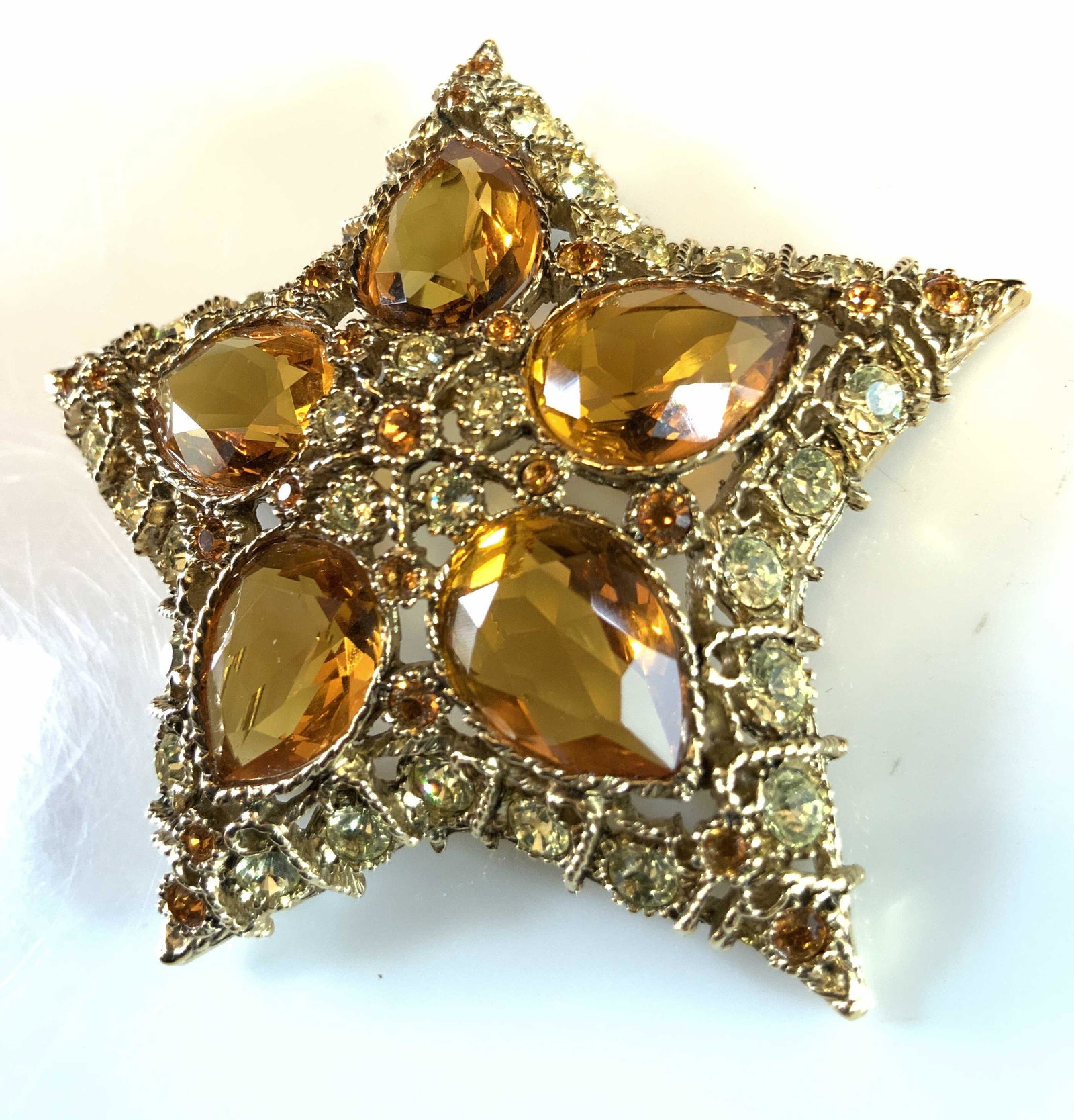 KJL Statement Bejeweled Star Brooch: Kenneth j Lane signed designer Crystal Encrusted Gold Toned Pin ,estate jewelry, vintage jewelry, designer costume jewelry, statement jewelry, measures diameter app 3 inches