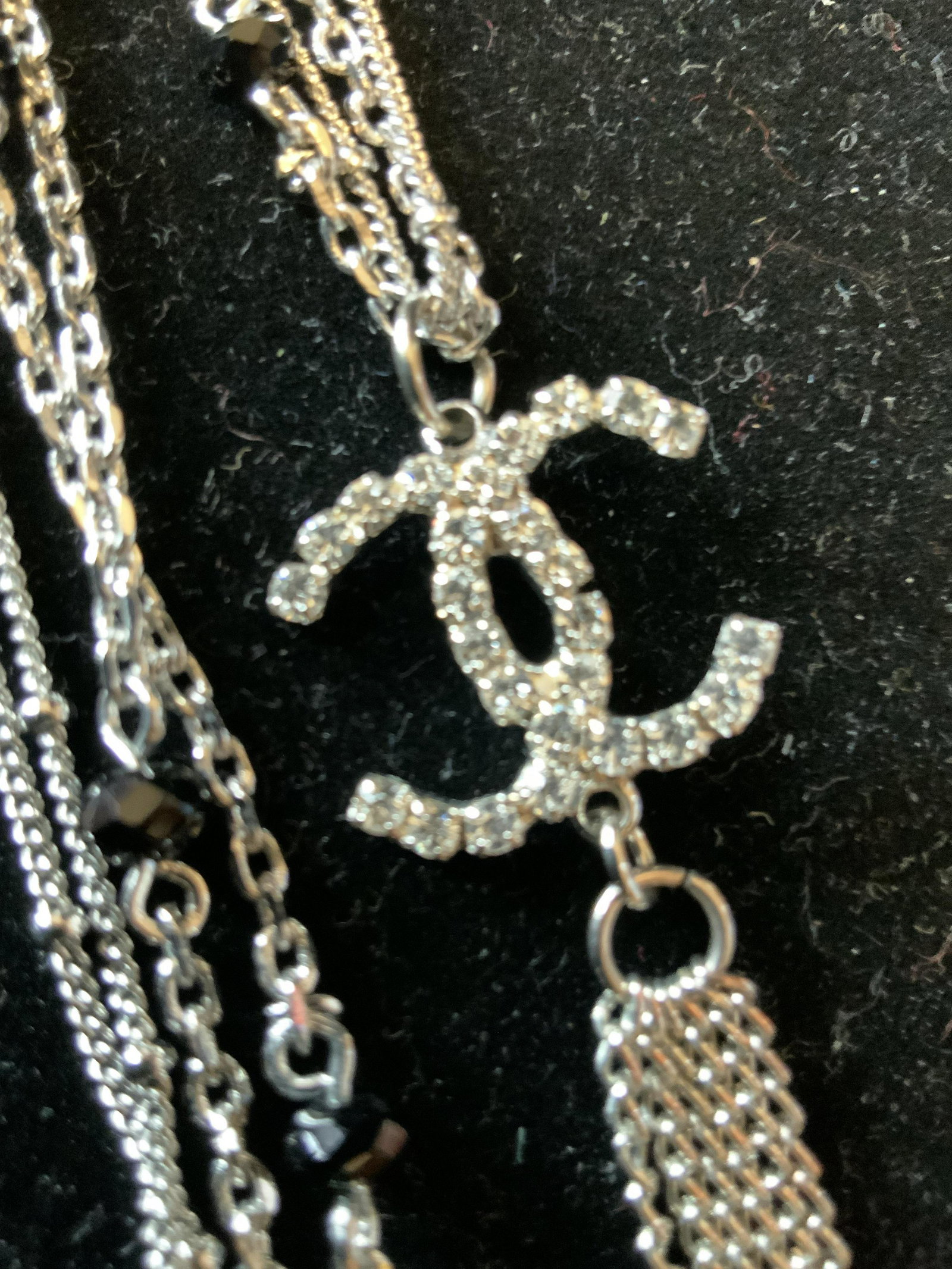 Vintage Silver Rhinestone CHANEL Style Necklace: Estate jewelry, necklace has double chain silver toned with black stone accents,Double Linked CC, iconic Chanel Symbol, no other markings found, tassel from CC pendant measures app 5.5 inches, length 