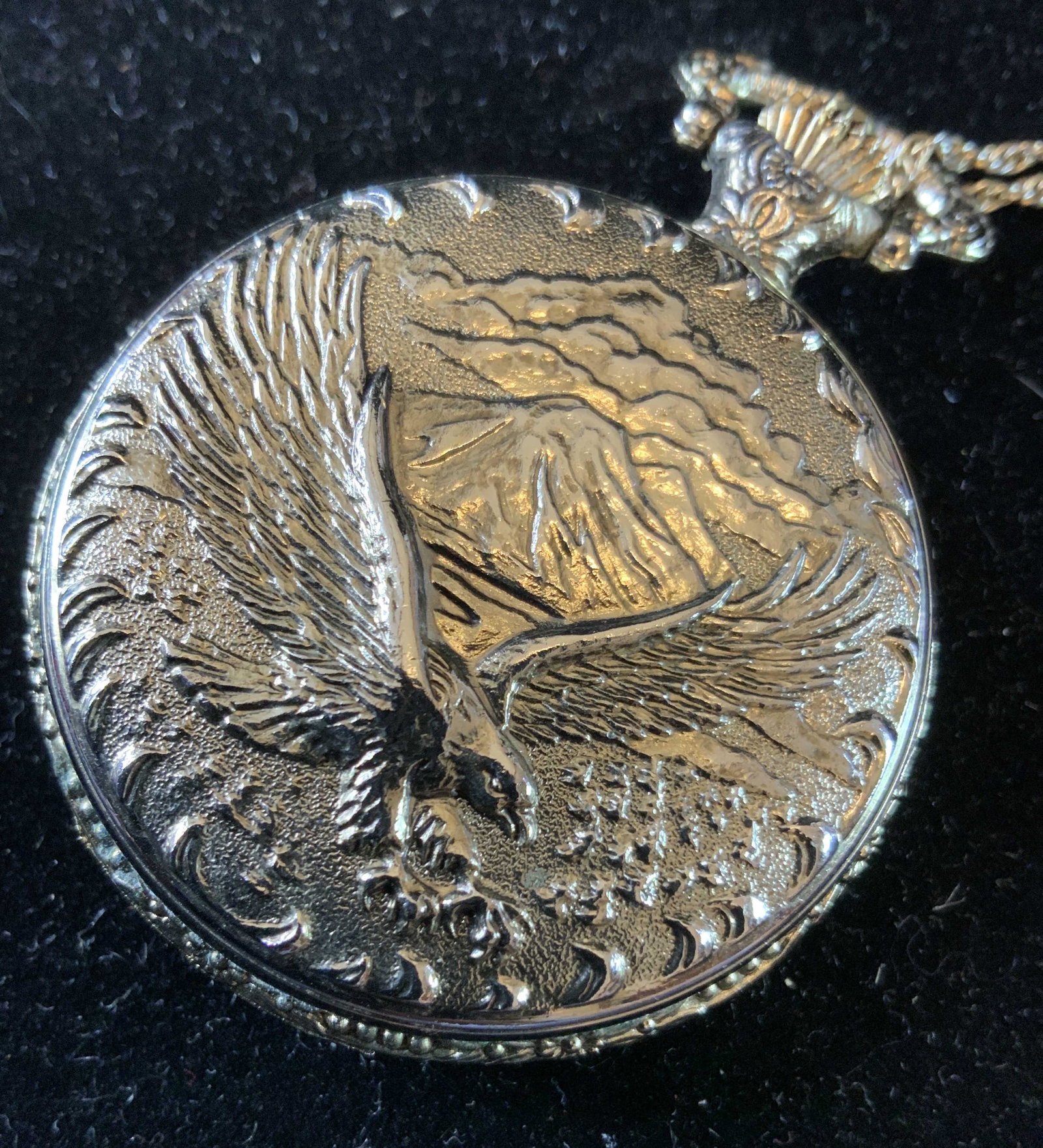 Americana Pendant Necklace: Vintage necklace, estate jewelry, possibly a locket, one side Statue of Liberty, other side American Eagle Symbol, measures app 2 inch diameter gold toned chain measures app 13 inch drop, Ladies vinta