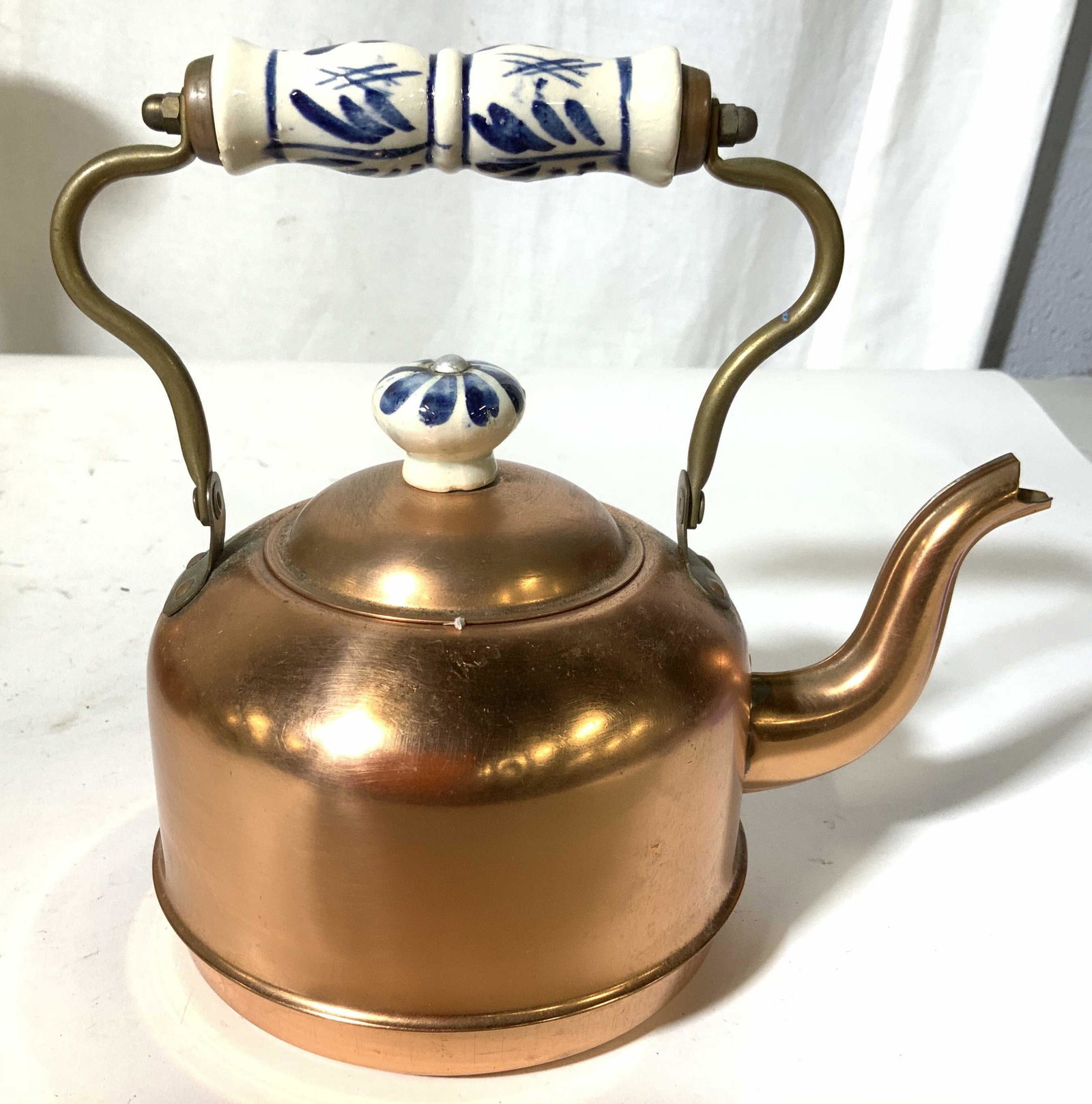 Antique Copper Tea Pot w Porcelain: Blue white porcelain handle grip and finial to lid, antique copper w brass detailing, measures w handle up app 8.5 inches, to spout app 8 inches, kitchen collectible, tea kettle, tea pot,