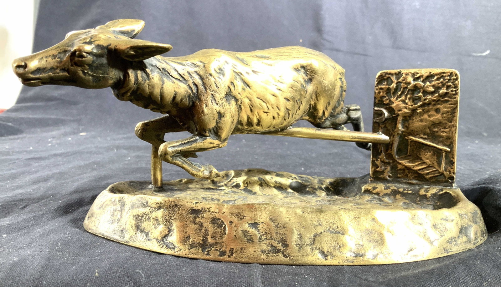 Austria Gilded Metal Deer Form Tray: Signed Austria on side, piece appears hand crafted deer jumping over a hurdle with brass rectangular slot possibly for mail, cards, documents, has Forrest scene in relief, tray, desk top accessory, de