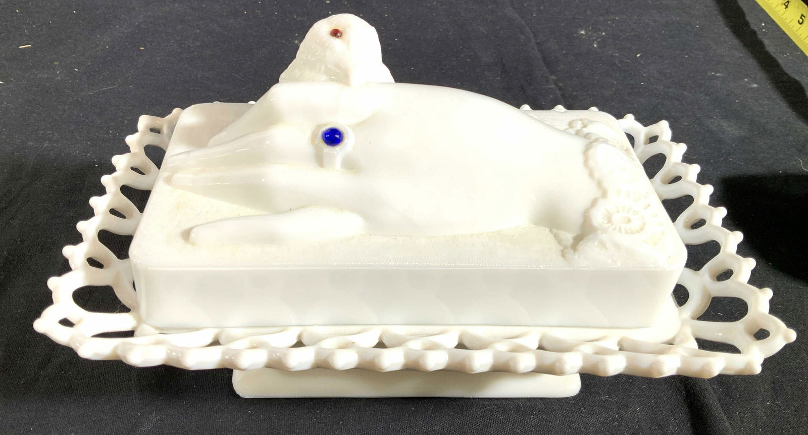 Antique Milk Glass Bird in Hand Lid Bowl: Collectible milk glass lidded tureen, lidded bowl, covered dish, candy dish, tiered base, open scalloped edges lid with a hand holding a bird, blue glass ring detail on hand, glass eye on bird, measur