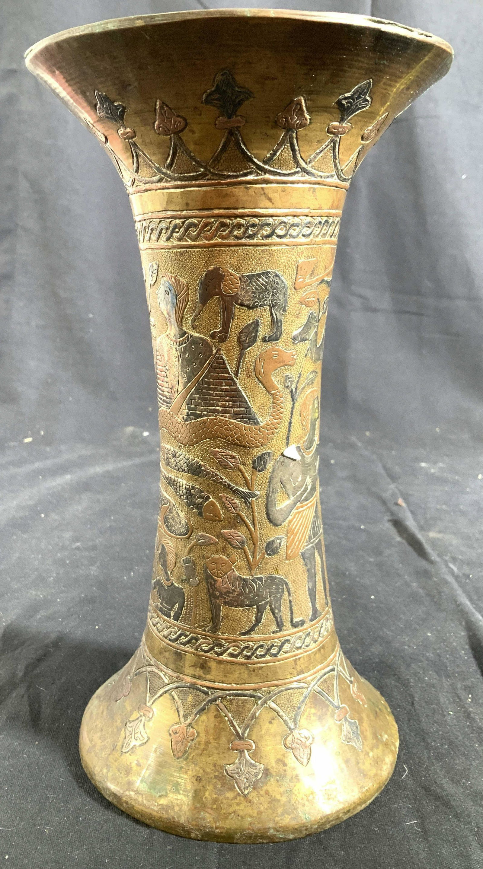 Syrian Mixed Metal Vase Vessel: Hand crafted decorative arts design of camels, Figurals, elephant, snake fish, architectural images and more, measures ht app 10 inches diameter app 5 inches, tableware, tabletop decor, decorative art
