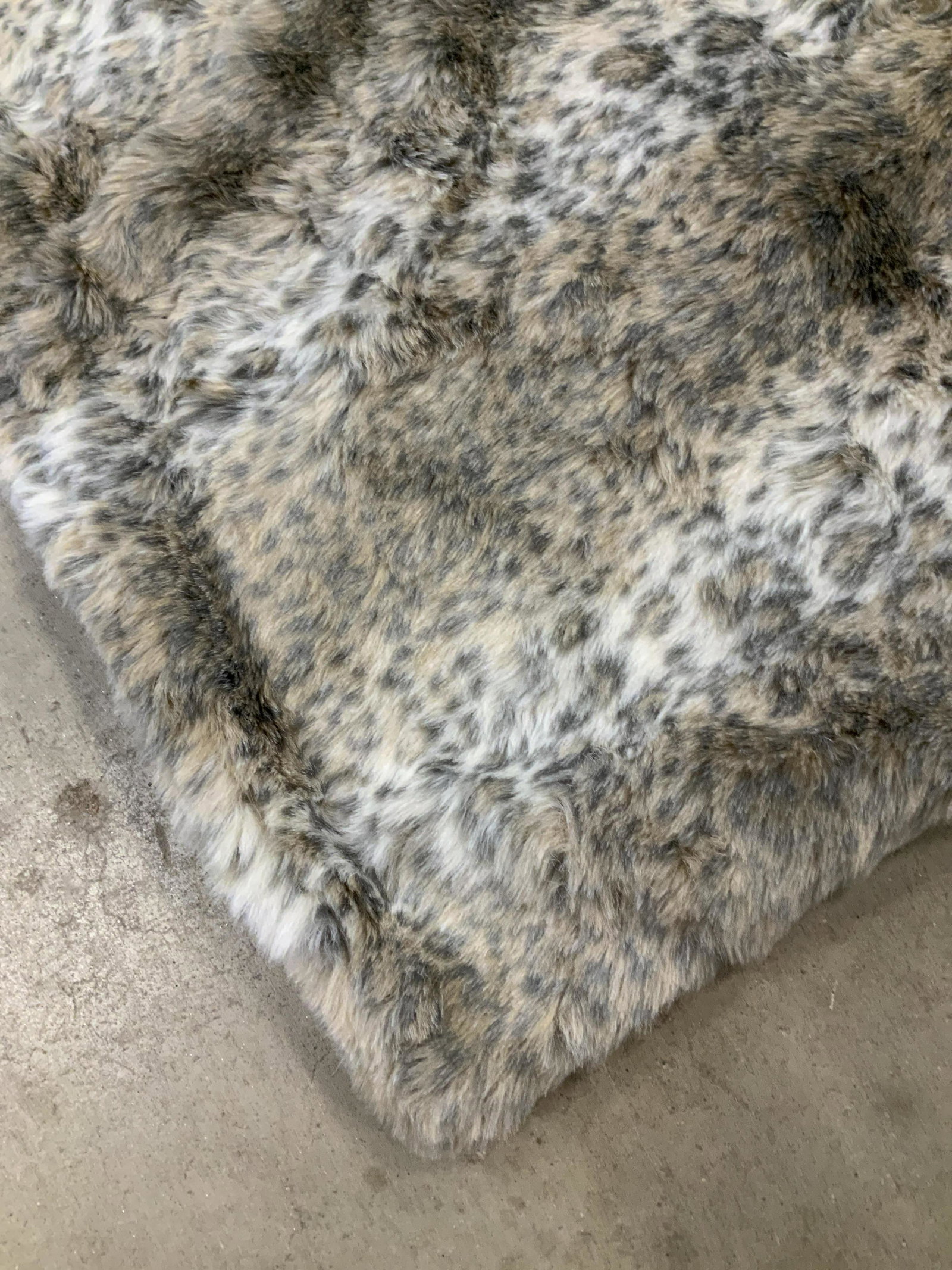 Pair Nicole Miller Faux Animal Throw Blankets: Throw blankets, toss blankets decorative accessories, property of New York City Home Stager, good condition each measures app 50 by 59 inches