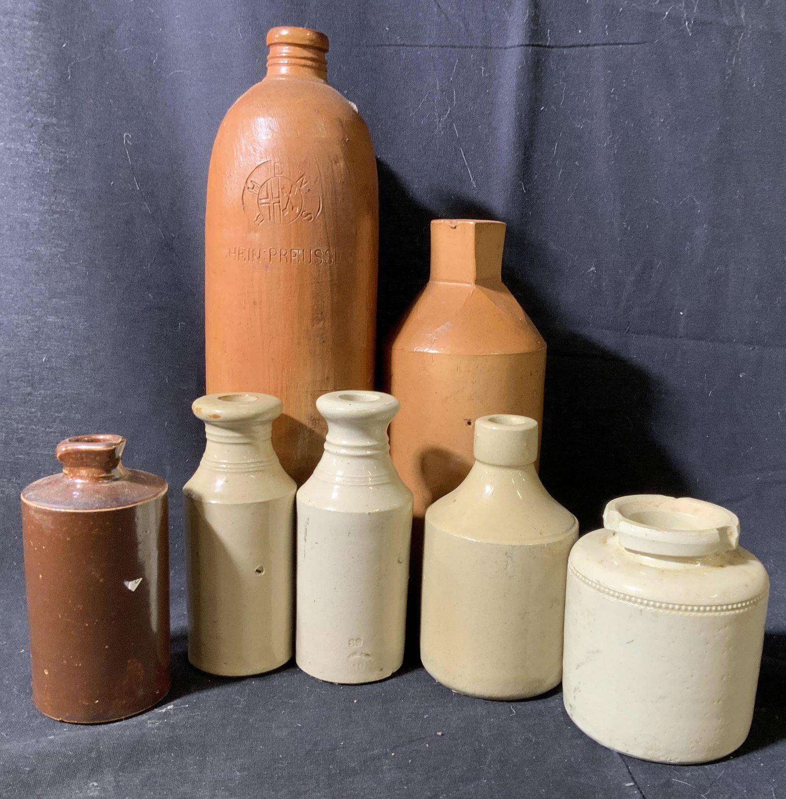 Stamped Marked Collection Early Ceramic Vessels: Bottles, jugs, vase, salt glazed ceramics, stamped, trademarked, stamped, one reads Skey Tamworth, one reads Hein Preusseu, one reads Dalton Lambeth, some illegible, tallest measures app 12 inches, co