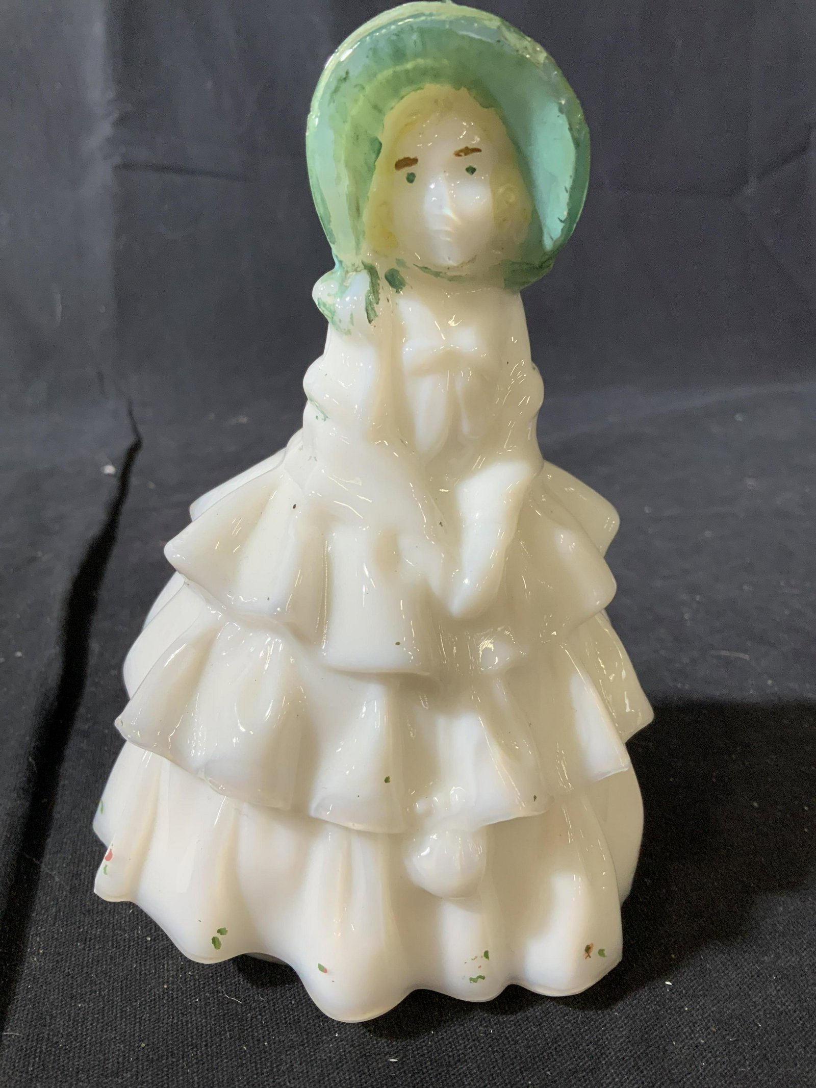 Group Milk Glass Desk Top Collectibles: Lot includes girl in hoop skirt w green bonnet ht 6 inches, binoculars, pipe on a stand, knife with scenic painting and painted handle, and hatchet form length app 6.5 inches, collectible milk glass f