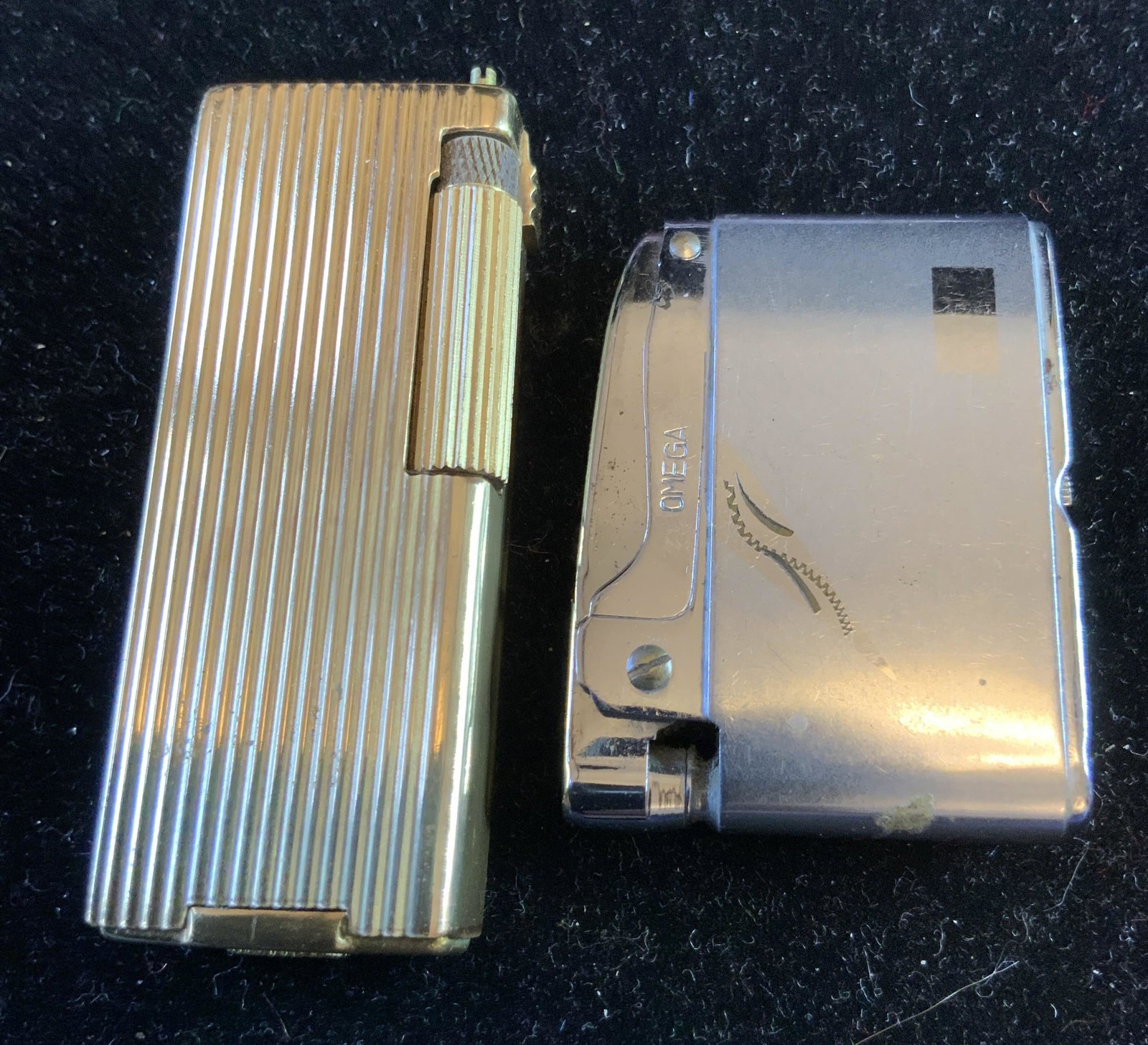 Lot 2 Vintage Lighters: Omega and caddy Japan, taller measures app 2.5 inches, smokers accessories, ,collectibles, desk top accessories,