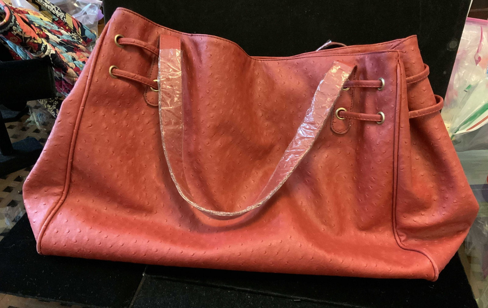 Never Used Faux Red Leather Satchel: With woven cording and double tassel detailing, satchel, carry all, tote bag, pebbled faux leather in brick red tone, lined interior, never used, good condition, inside has label for signature club, m