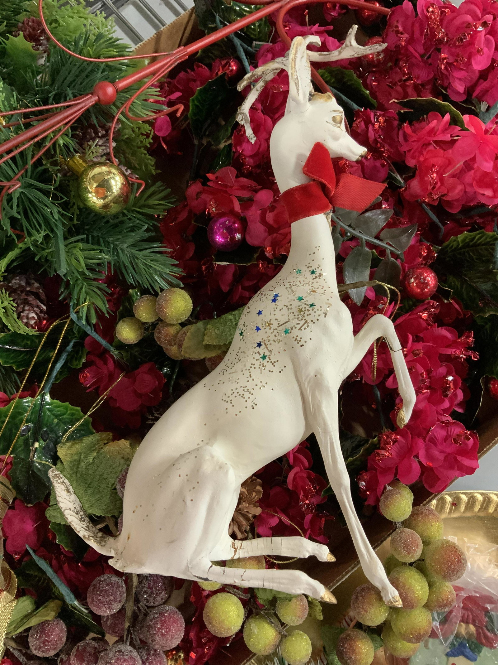 Box Lot Vintage Christmas Decorations: Unusual vintage ornaments, tree trim, table ware, including, vintage deer, wooden shoe, sparkly fruit, glass ornaments, faux florals, brass bells, metal red candle holder, squirrel and rabbit figurals