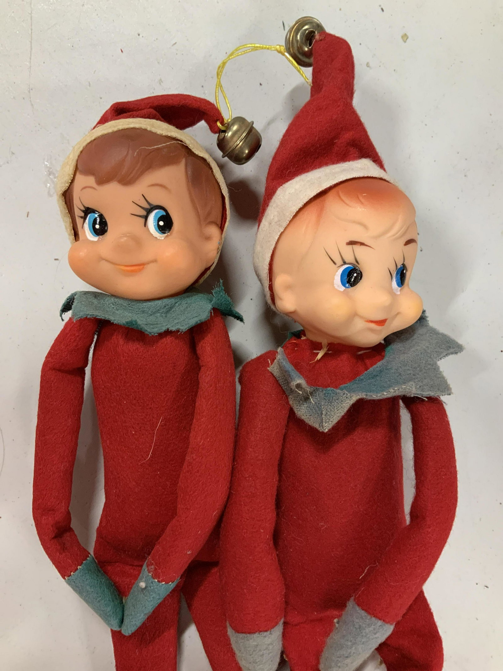Vintage Christmas Elves Sleigh and Basket: Plaid handled lidded metal basket storage measures 8 inches ht, top app 14 by 10 inches, fold up wood painted sleigh htb6.5 inches, two vintage elf on the shelf dolls decorative moveable arms and legs
