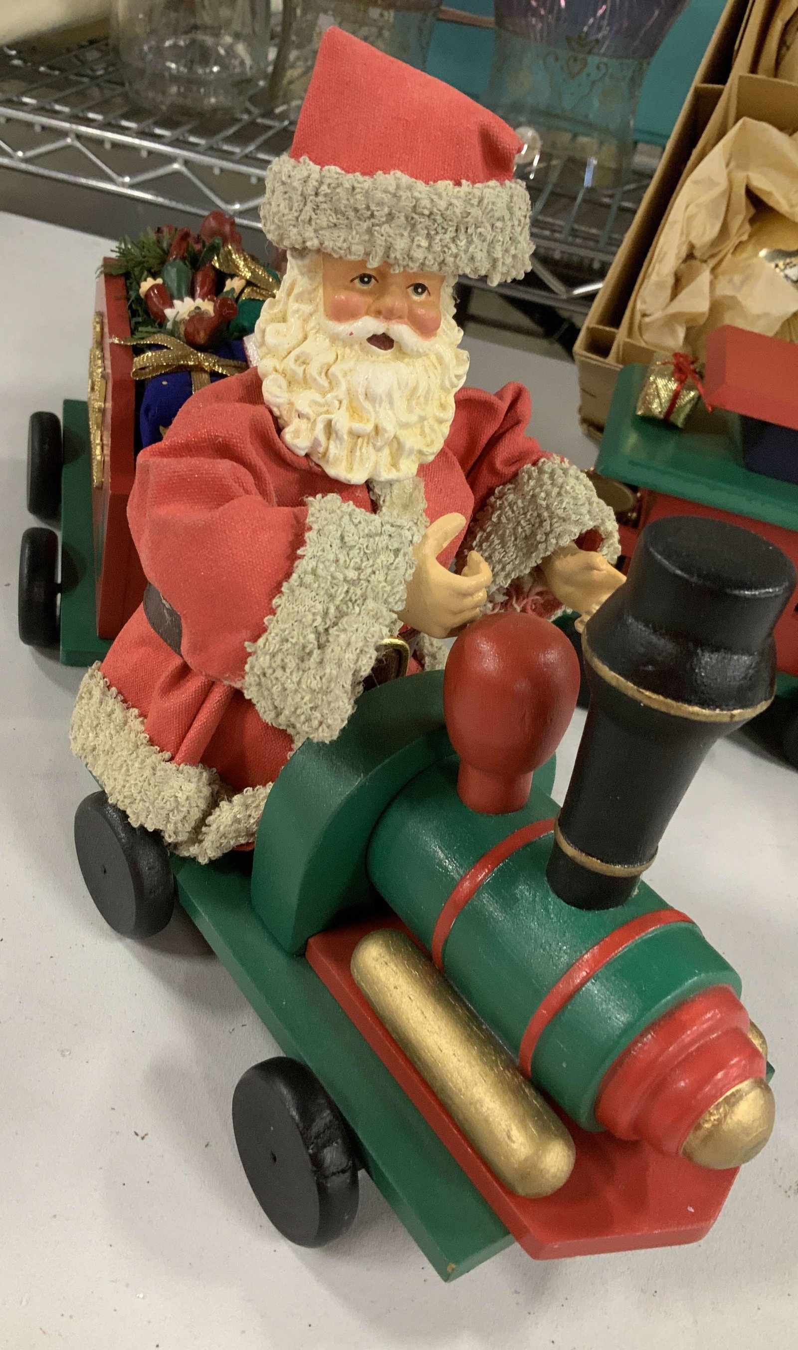 Vintage Christmas Holiday Decorations: Composite lucite family of penguins, frosted Figurals, 7 penguins tallest measures ht App 8 inches, vintage Wood holiday train with attachable cars, Santa at the lead, cars of presents, elves and tree
