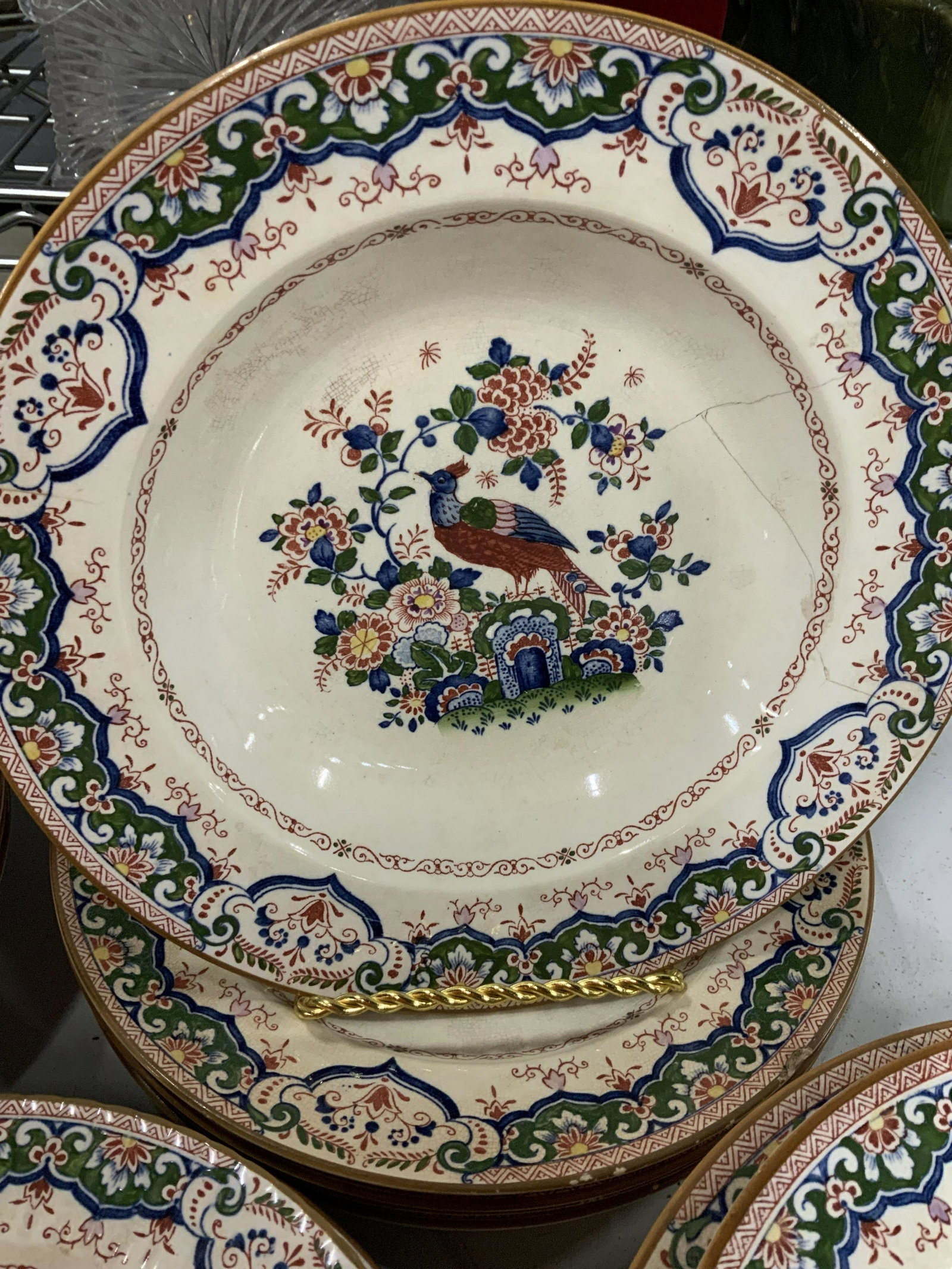 Booths China England , Old Dutch Pattern Service: Partial dinner service, place settings, antique English China, some have chips, aging to glaze,12 dinner plates each measures 9 3/4, 8 deep dish soup plates each measures 9.5 inches diameter, 7 salad 