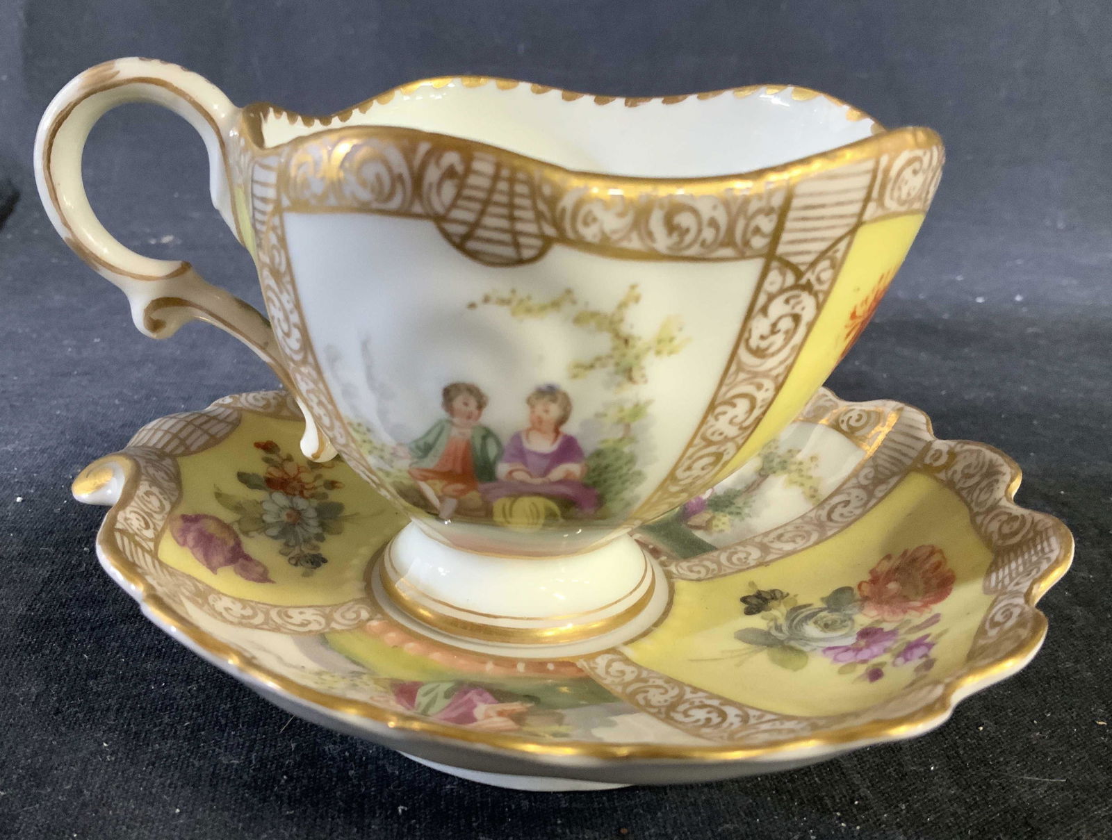 Dresden Hand Painted Porcelain Cup Saucer: Marked underside for Dresden, Victorian Figurals and scenery, vintage possibly antique, porcelain, table ware, collectible, measures ht cup 3 inches saucer diameter app 5 inches