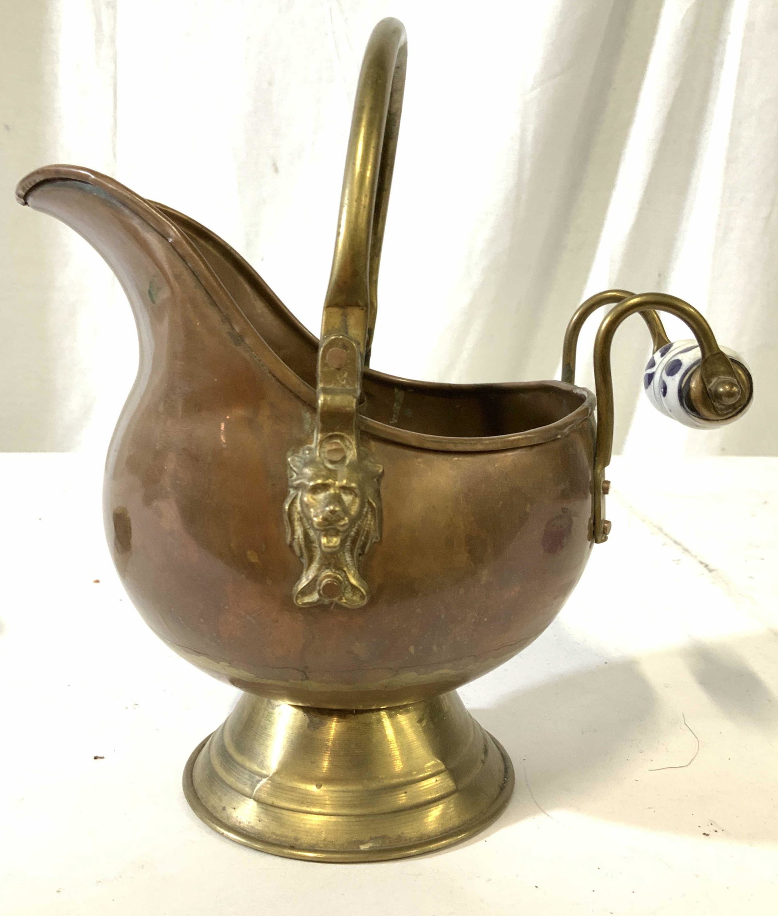 Copper Brass Porcelain Coal Scuttle: Vintage possibly antique, copper kitchen utensil, up cycle planter, cache pot, bowl, decorative accessory, measures ht 8 inches width spout to handle 9 inches, Lion head detailing,small side dent