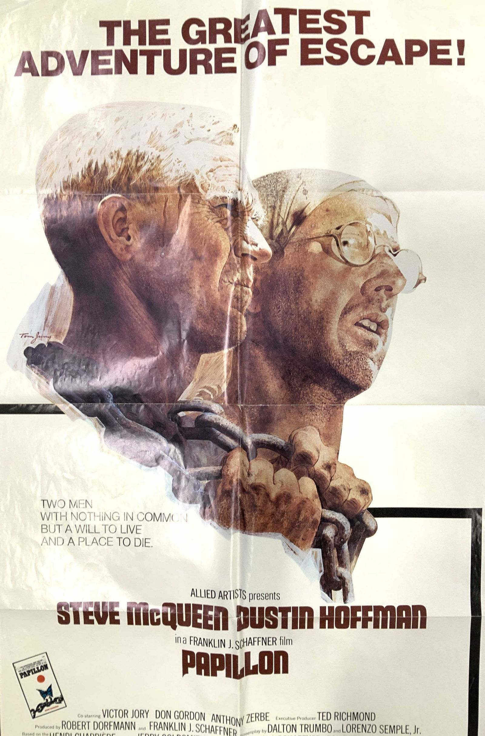 Vintage Papillon Movie Poster Ad: Steve McQueen and Dustin Hoffman Papillon vintage movie poster, has some wear to edges, some creases Unframed measures 41 by 27 inches, copy righted 1973 by United artists printed lower left, collecti