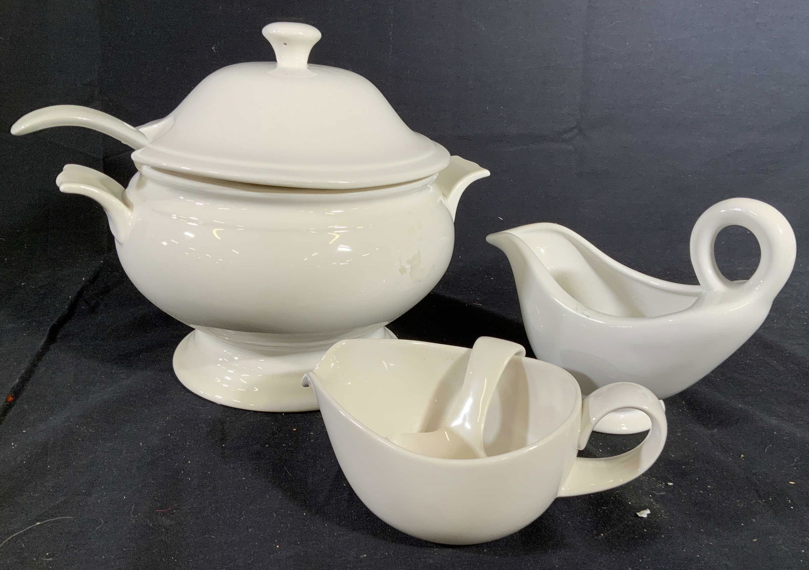 Lidded soup tureen and more porcelain: White ceramic porcelain serving pieces, cordon blue lidded tureen w ladle ht app 10 inches, gravy boat marked for Italy and Bloomingdales, and sauce boat w ladle, tableware, serving dish, decorative t