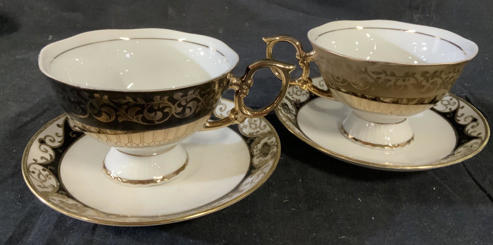 Black gold white porcelain 2 cups saucers: Fine bone China, collectible cup saucer sets, each measures ht 3 inches diameter app 6 inches, coffee service, tea service, collectibles, tea service for one, tableware, collectible china