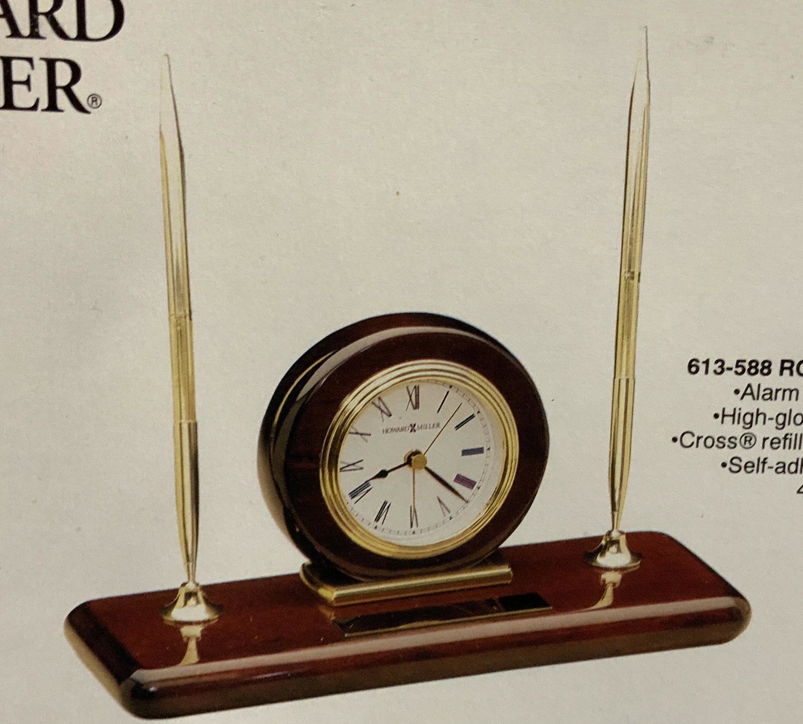 Never opened Howard Miller Rosewood Desk Set: New in box, Howard Miller rosewood desk set includes alarm clock, with pen set, self adhesive brass plate, refillable pens, high gloss rosewood finish, box measures 6 by 10 by 5 inches