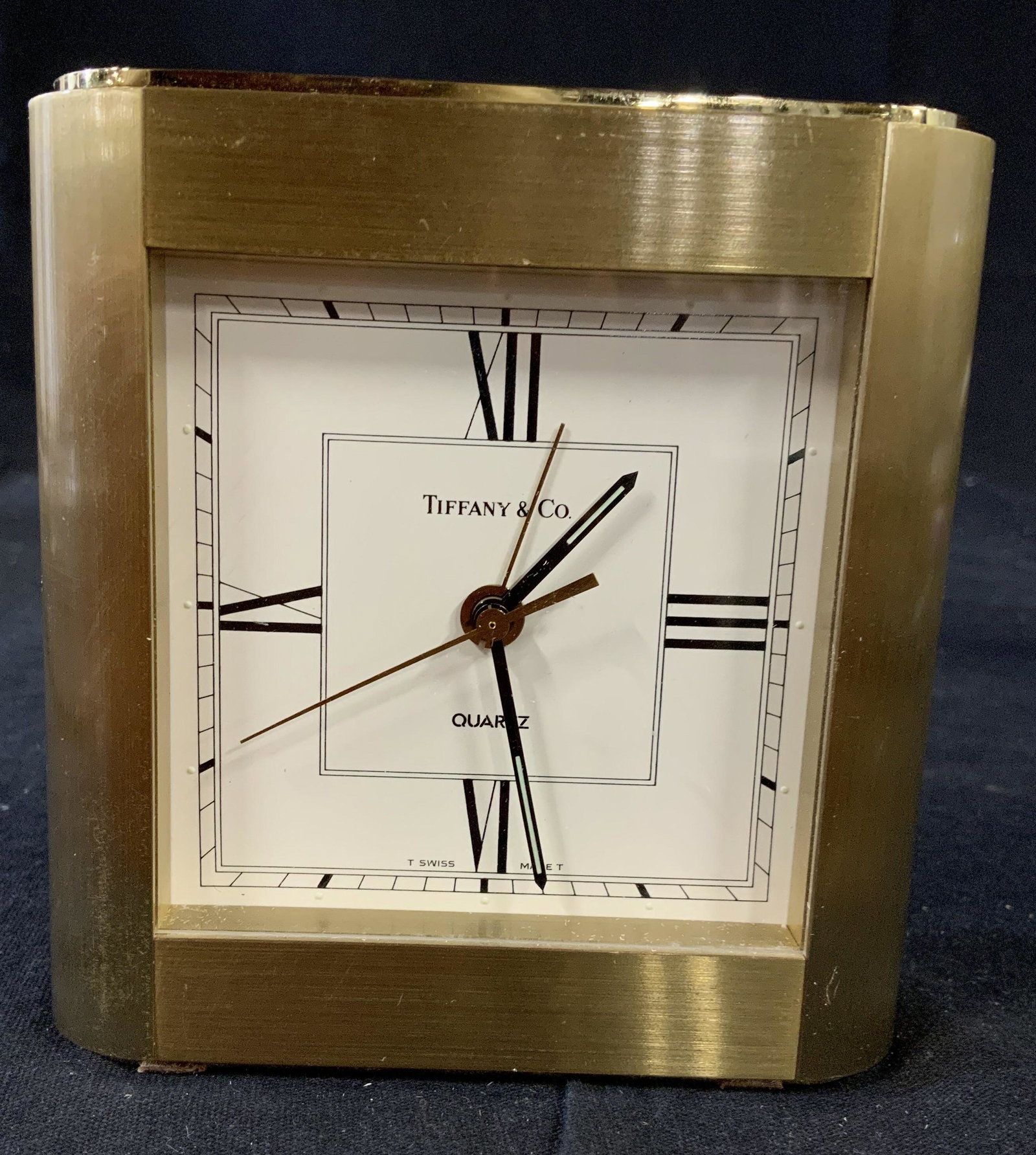 Tiffany and Co Brass Alarm Clock, Engraved: Brass alarm clock, desk clock, marked on face for Tiffany & Co, top of clock has engraving toys r us, measures app 4 inches ht