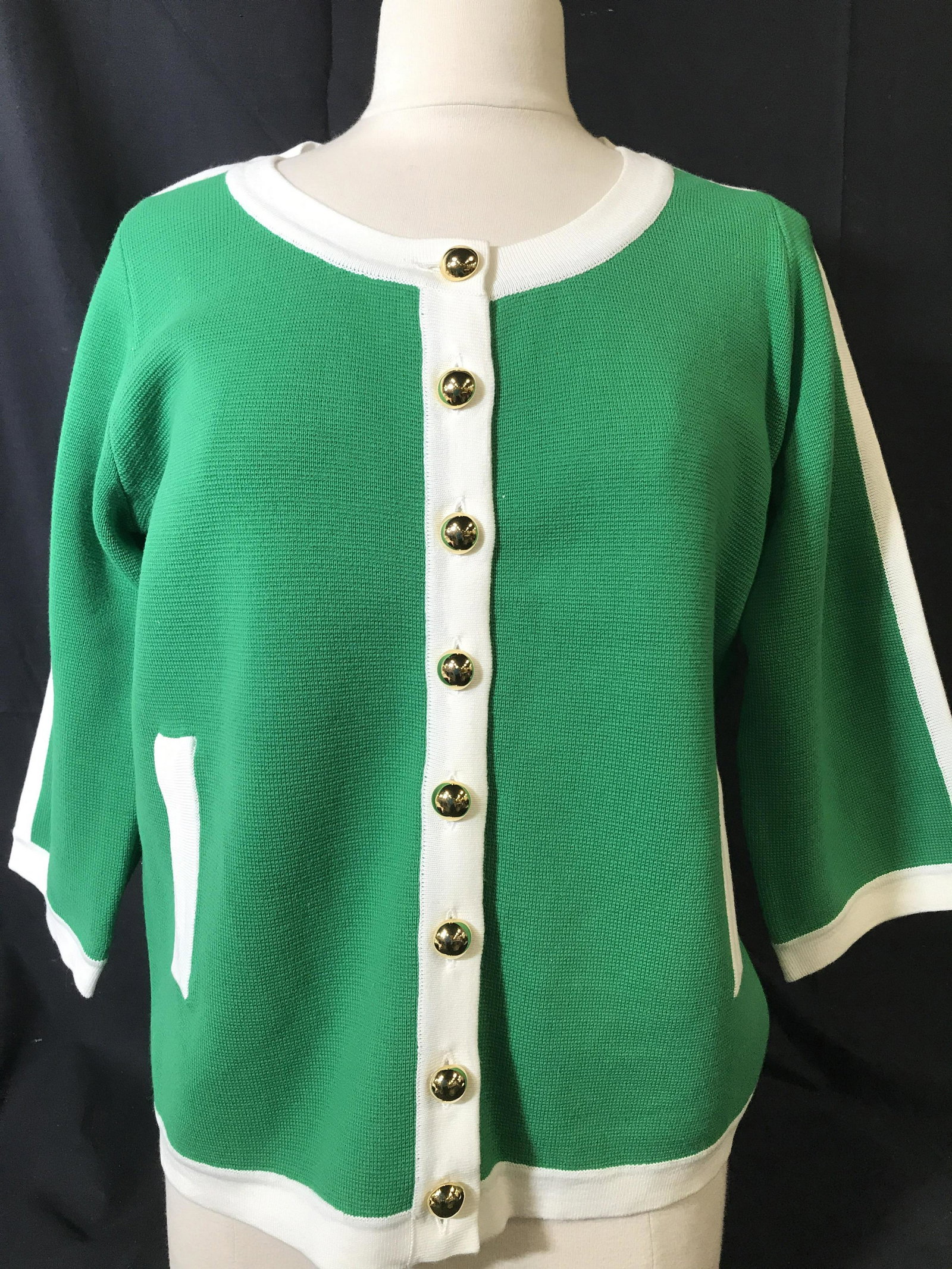 Louis Dell’Olio Green Cotton Knit Pocket Sweater: In the style of Chanel, this green color sweater has crisp white hems, front side pockets, gold tone metal vintage button style buttons from neck to hem, wide 3/4 sleeves, size Medium, cotton knit, 60