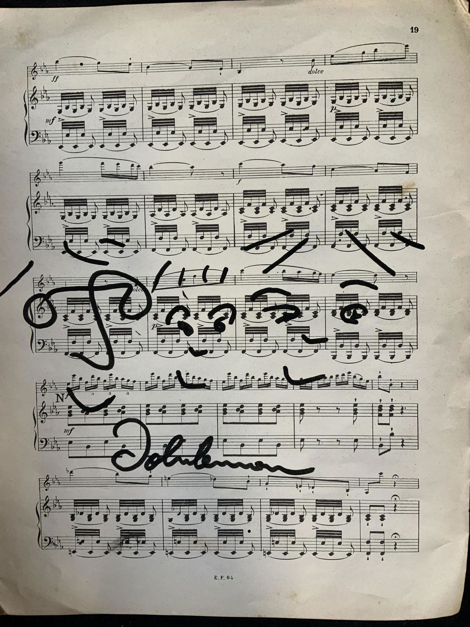 After John Lennon Marker on Music Sheet: Illustration of three faces on sheet of music, aging and discoloration to paper, wear to paper, foxing around paper, unframed measures 12.5 by 10 inches, All lots that do not carry established documen