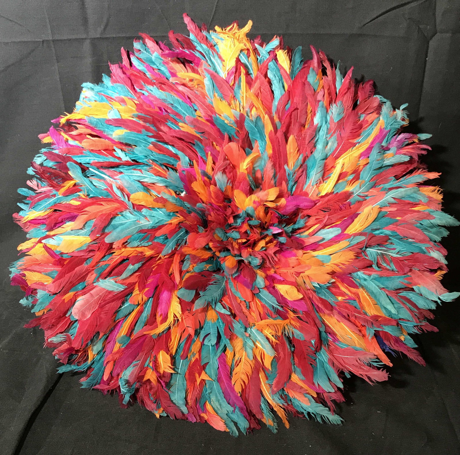 Cameroonian Bamileke Feather Hat: Cameroonian Bamileke feather hat or Juju Hat or Tyn hat, subject consisted of blue orange and various shades of pink dyed feathers, these hats have origins in Western Cameroon Central Africa used for 