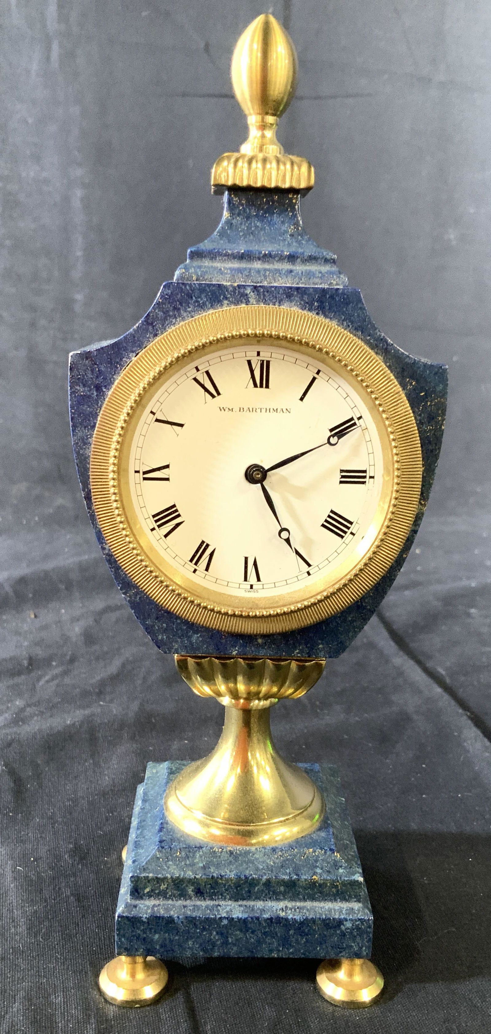 Vintage WM BARTHMAN Marble Pedestal Clock: Vintage possibly antique mantle clock, desk clock, signed in face for WH BARTHMAN, blue marble sculpted encasing with brass finial, face trim, pedestal and feet, measures ht 9 inches, width 3.5 inches