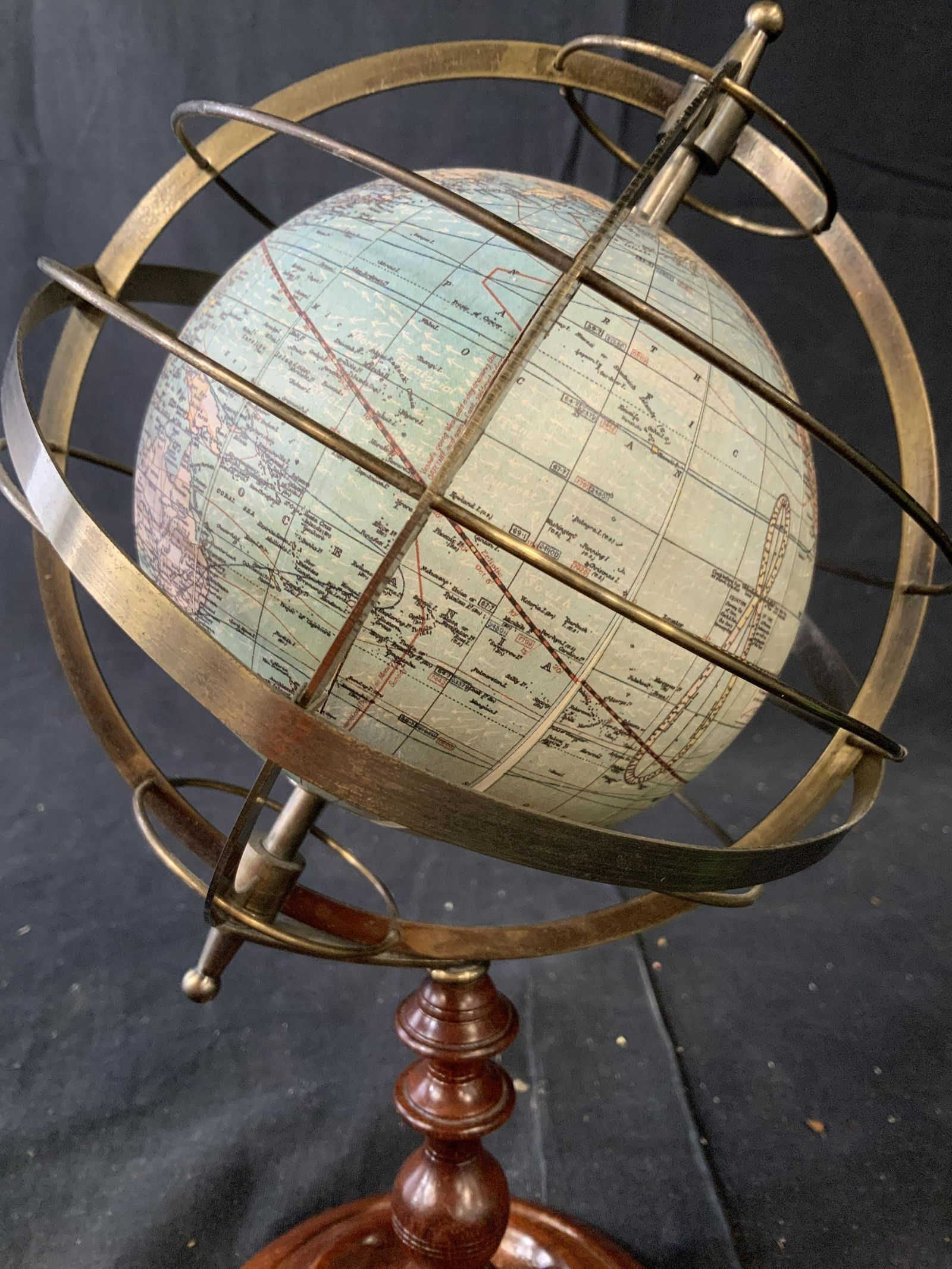 Vintage Spherical Globe on Stand, USA: Vintage globe surface feels like paper over orb which tilts on axis brass armillary surrounds to the globe stands on mahogany wood base, some wear to globes surface, vintage desk accessory, collectibl