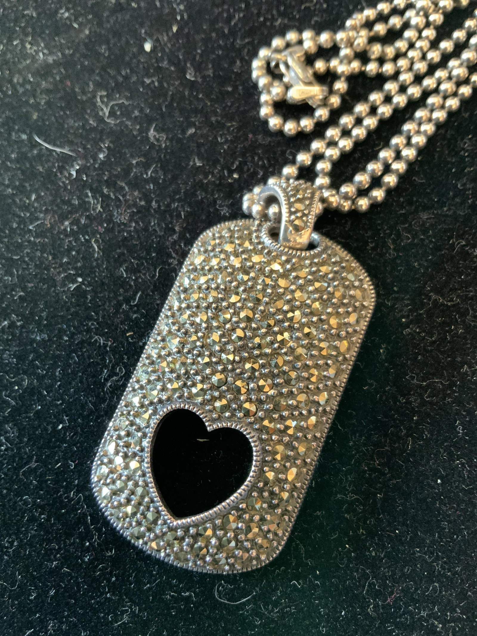Sterling Silver Marcasite Art Deco Necklace: Signed illegibly in verso, Sterling silver Pendant marked for Sterling, with open heart and rhinestone encrusted Design on silver toned bead chain, pendant measures app 2 by 1.5 inches, estate jewelry