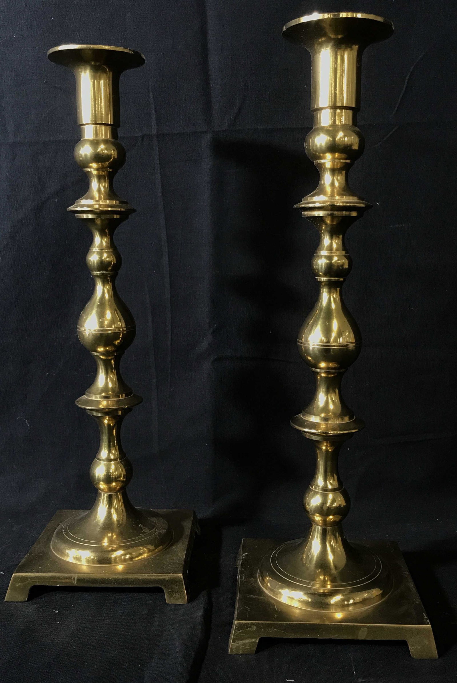 Vintage Twin Brass Japanese Candlestick Holders: Vintage pair of Japanese brass candlestick holders, measures approximately 14.75 inches at tallest point and 5 inches at widest, polished brass, bulbous design to stem, some oxidation and wax residue 
