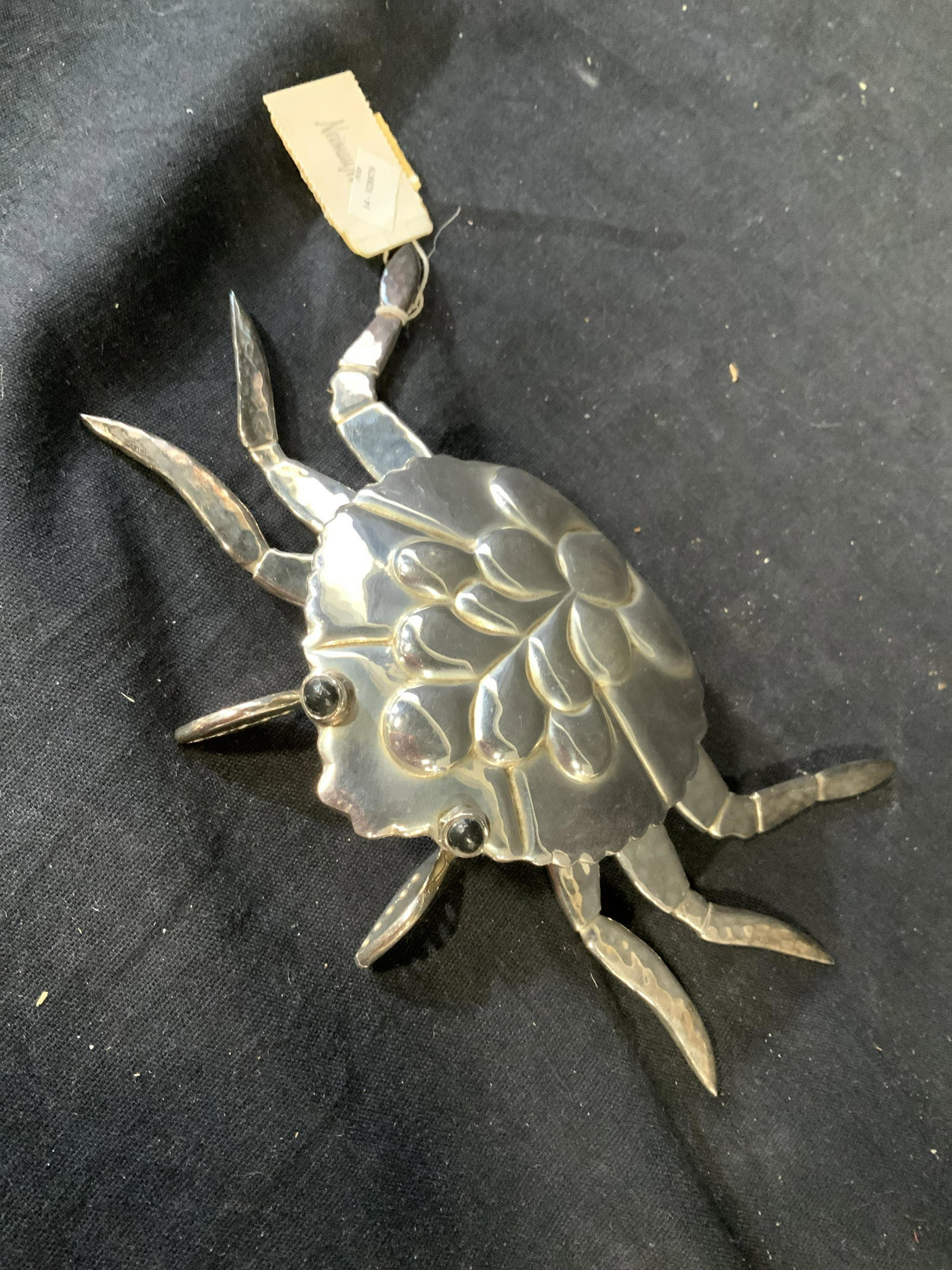 EMILIA CASTILLO, Silver Plated Crab Figural: Silver plated Crab Sculptural with movable hand hammered legs and front pincers, reposes design to shell black stone accent eyes, original price tag and felt carry bag from Neiman Marcus, made in Mexi