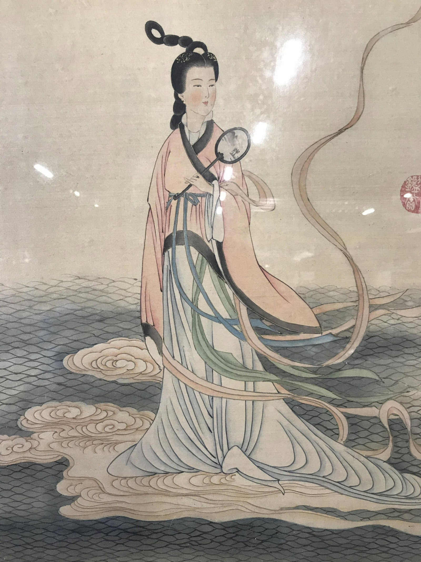 Oversized Chinese Hand Painted Silk: Chinese Hand Painted Silk, subject woman with mirror standing on a cloud above a sea emulating the mountains above the mist behind her, Chinese text can been seen written in the upper right section, v