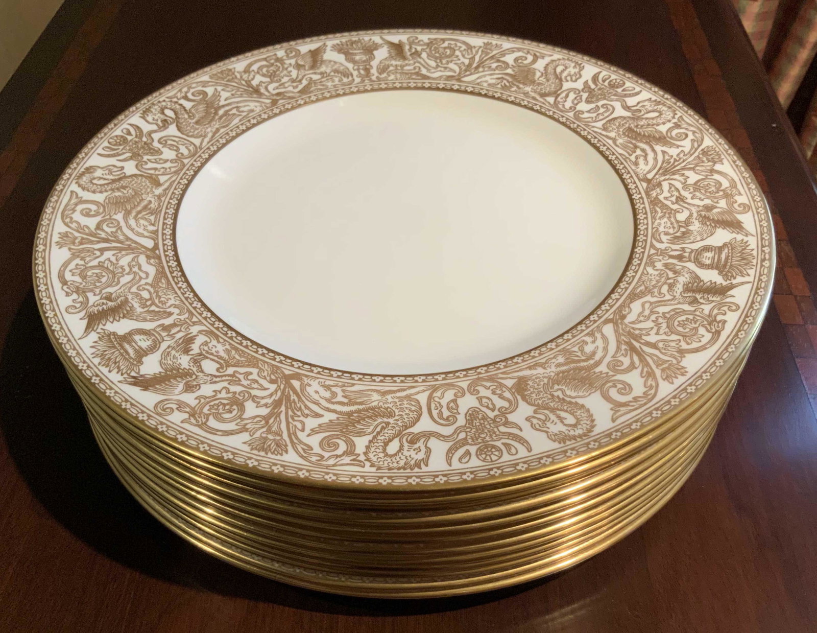 Set 12 Gold Wedgwood Florentine Porcelain Plates: Place settings, English bone China, wide gold borders with dragon forms, Gold FLorentine Pattern, fine porcelain, Wedgwood dinner service, each measures diameter app 11 inches, good condition