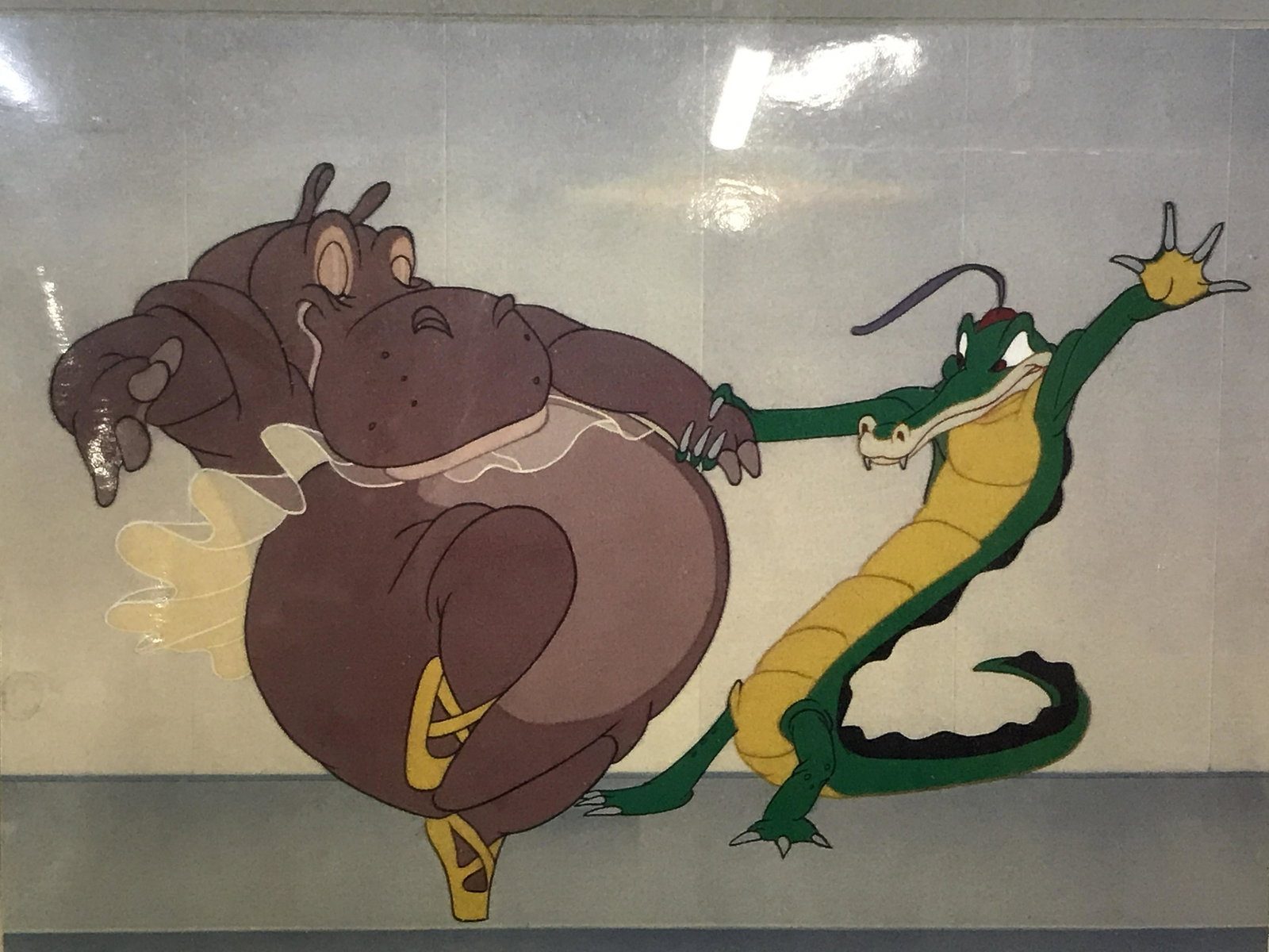 Digital Print of Disney’s Fantasia Scene: Digital print, subject scene from Disney’s Fantasia of Hyacinth Hippo and Ben Ali Gator dancing during the famous Dance of the Hours, no apparent signature, double matting int grey and blue, lack wo