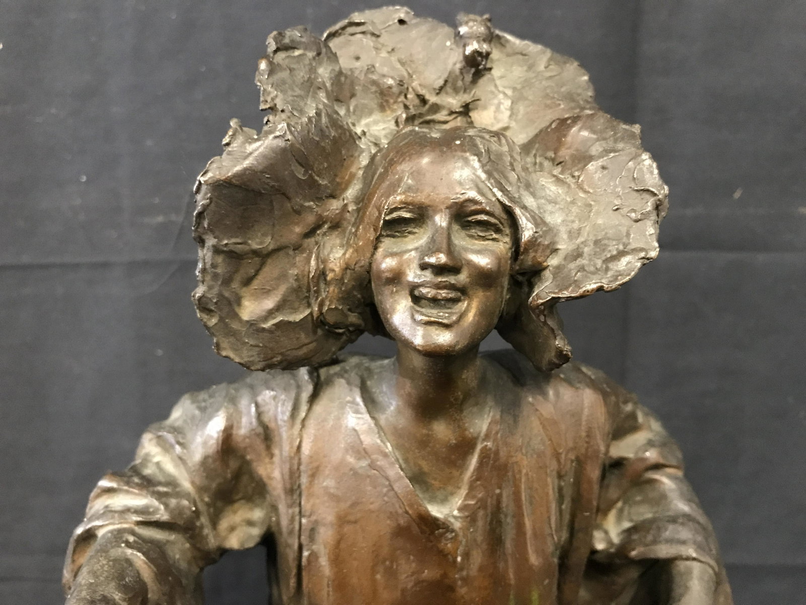 Signed Bronze Sculpture Giuseppe Renda: Signed bronze sculpture of a woman, Italian in origin, carved signature on the back lip of her dress reads G.Renda, subject depicts woman in long robes and large open floral type bead piece, similar t